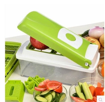 Green and white 12-piece food grate chopper with stainless steel blades chopping vegetables for kitchen use