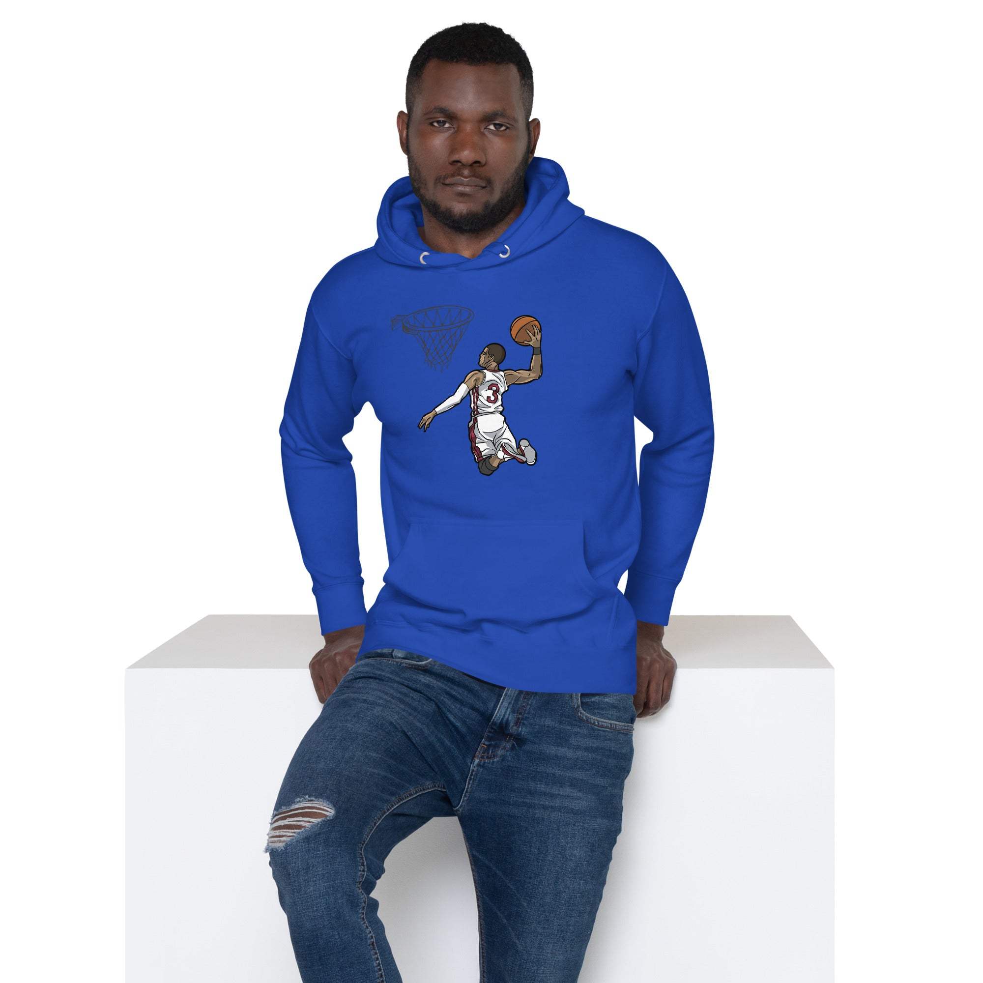 Man wearing blue basketball dunk hoodie with slam dunk graphic and ripped jeans sitting on white block