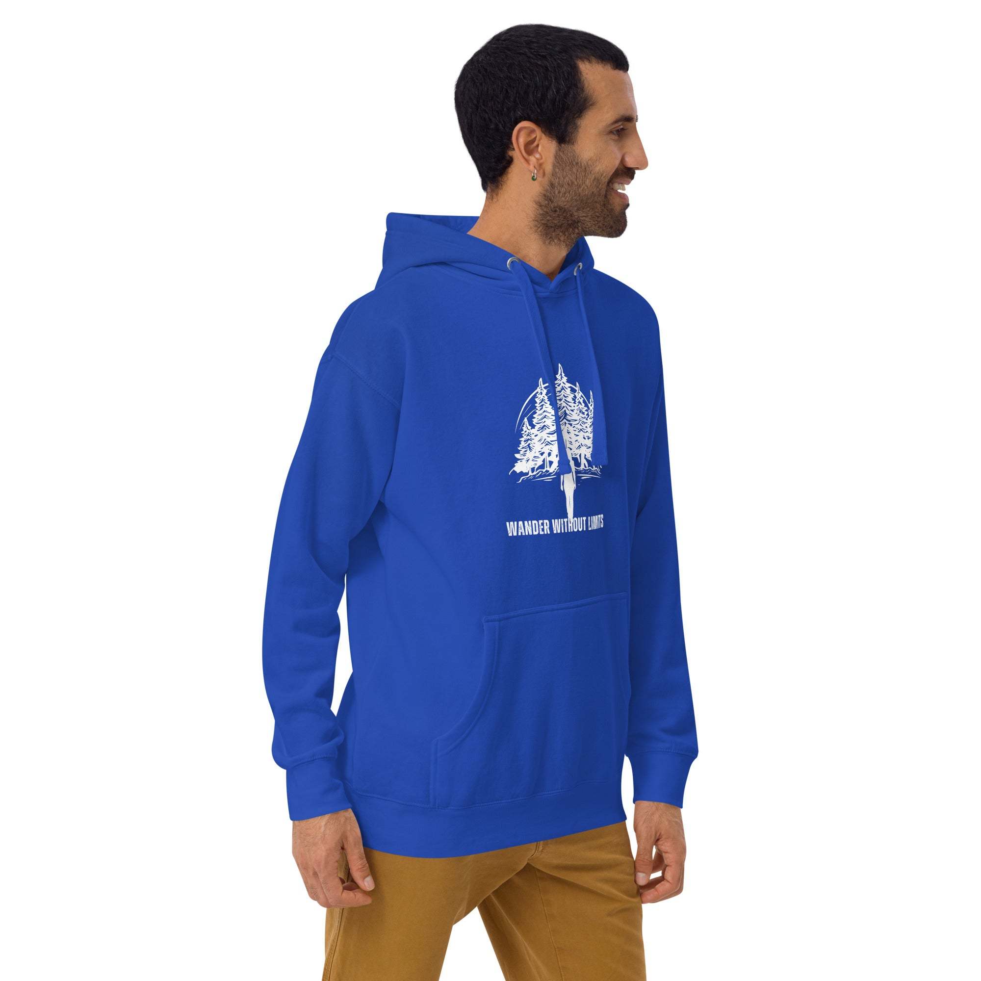 Man wearing blue Wander Without Limits Hoodie with wilderness tree graphic and front pocket