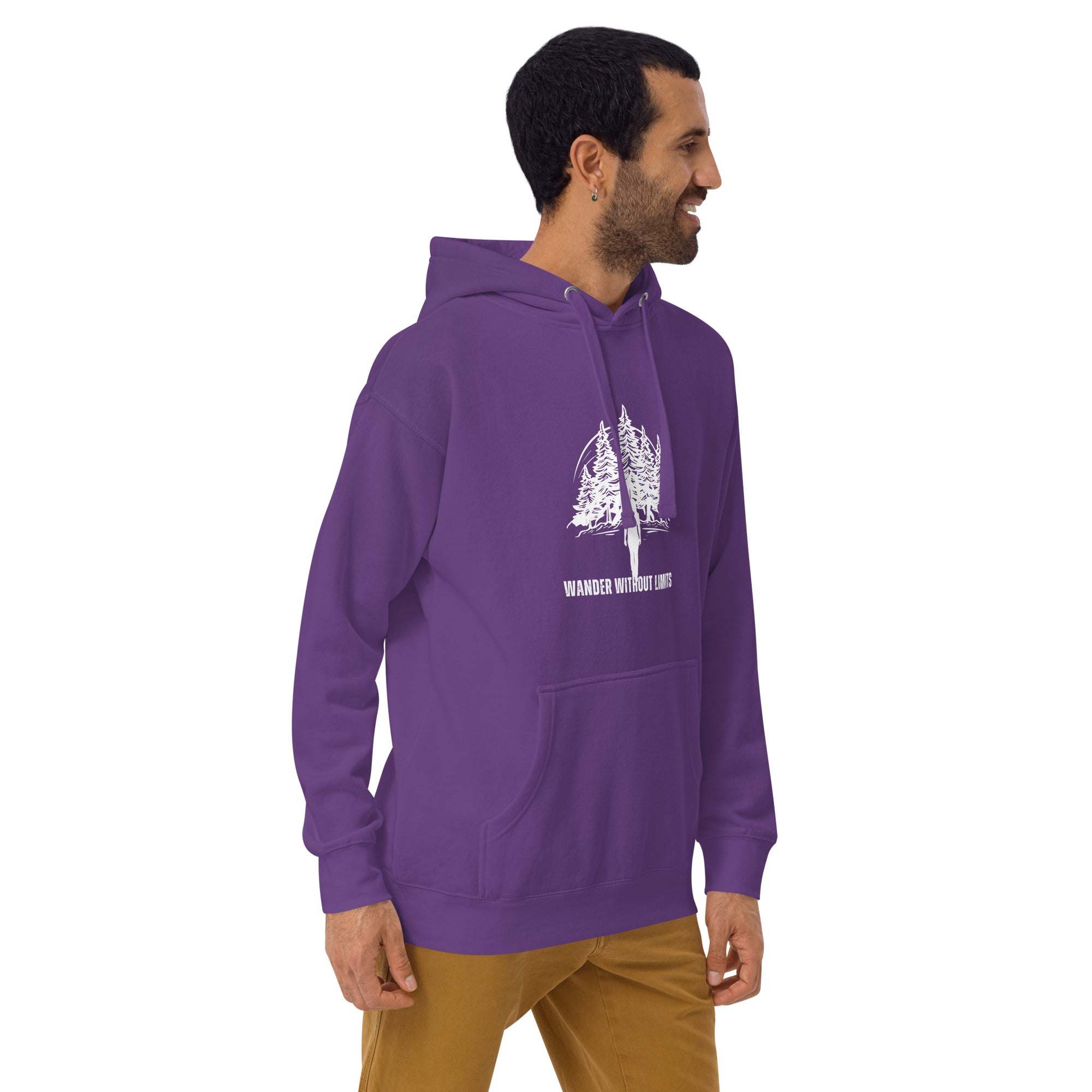 Man wearing purple Wander Without Limits Hoodie with wilderness tree graphic and kangaroo pocket