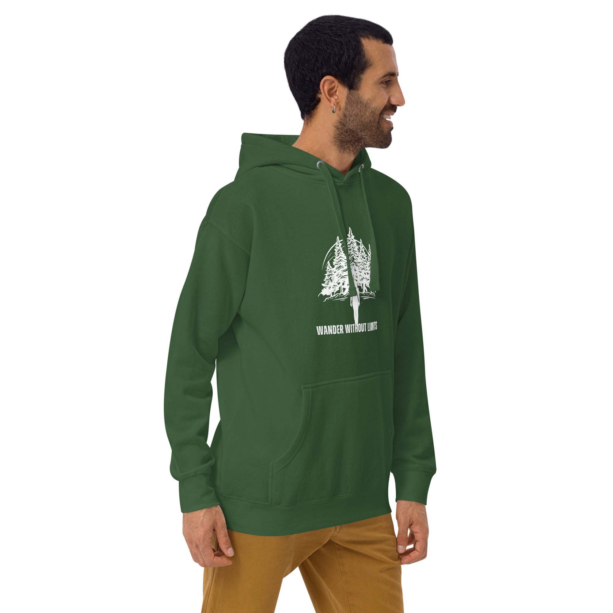 Man wearing green Wander Without Limits Hoodie with wilderness tree graphic and front pocket