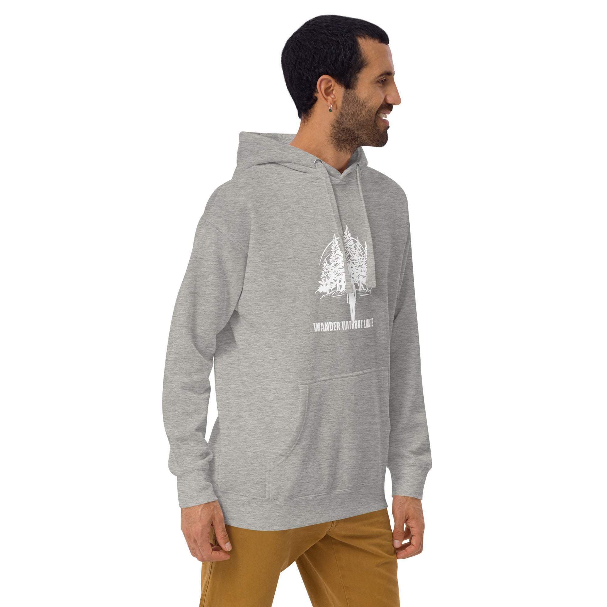 Man wearing gray Wander Without Limits Hoodie with wilderness graphic and front pocket