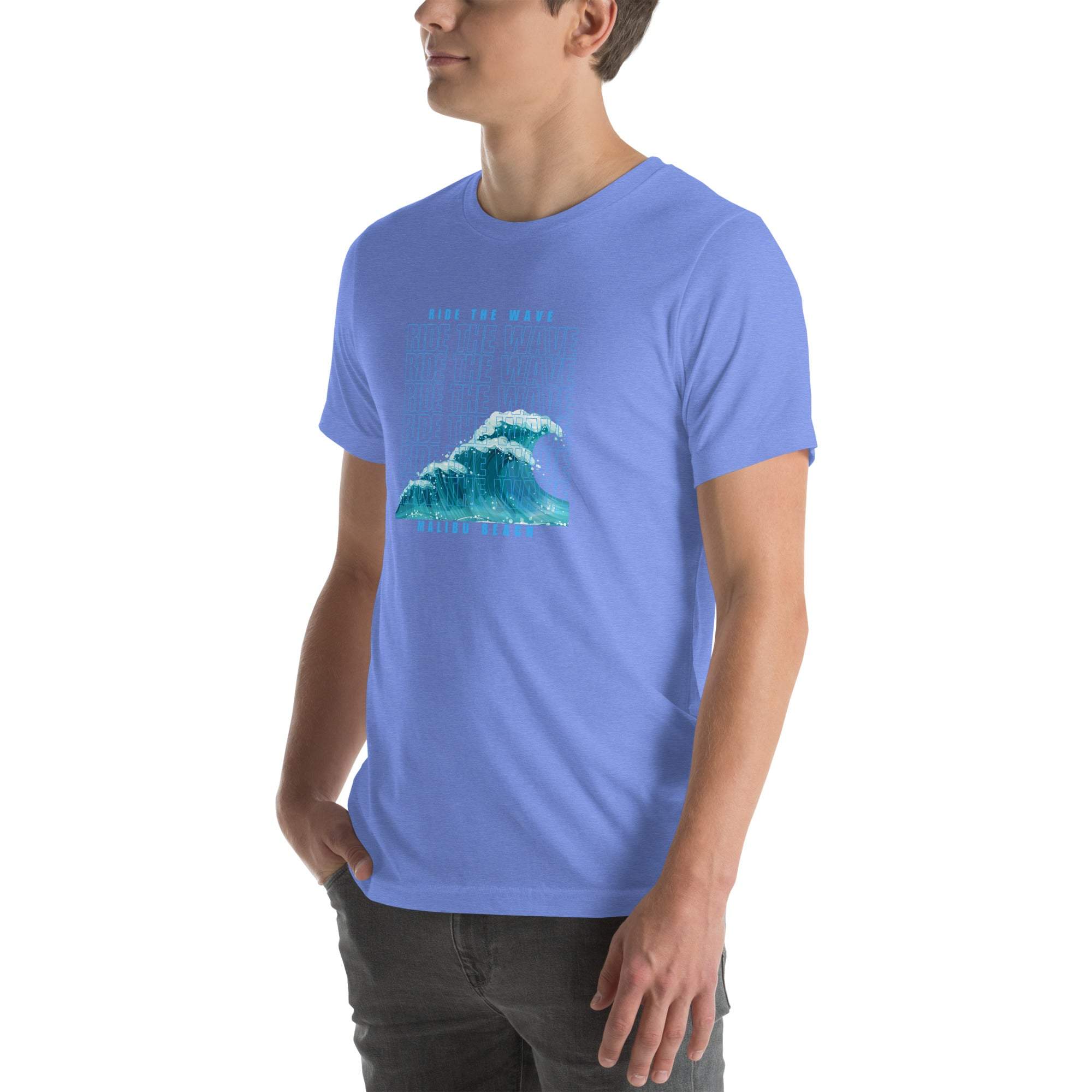 Man wearing light blue Ride the Wave T-Shirt with wave graphic on front