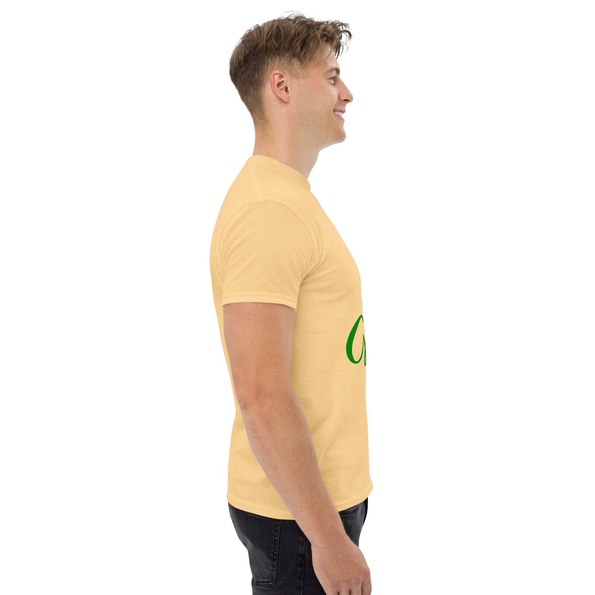 Side view of a man wearing a beige Go Green T-Shirt made from sustainable materials.
