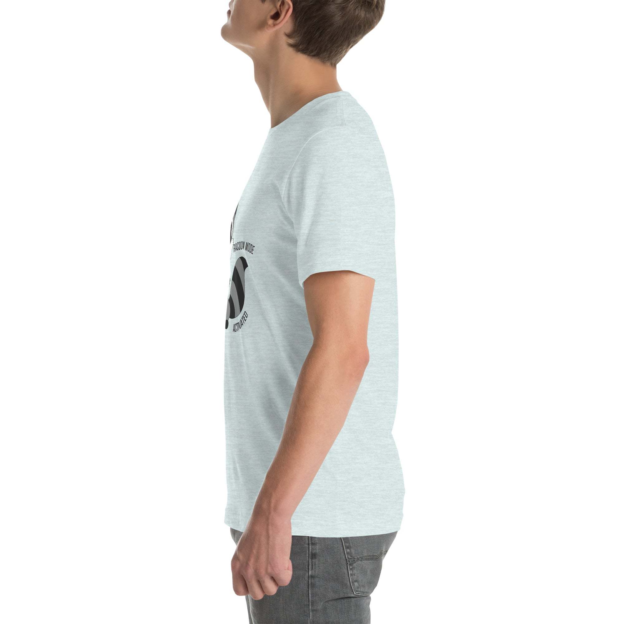 Side view of man wearing light gray Raccoon Mode T-Shirt with cartoon raccoon and text design