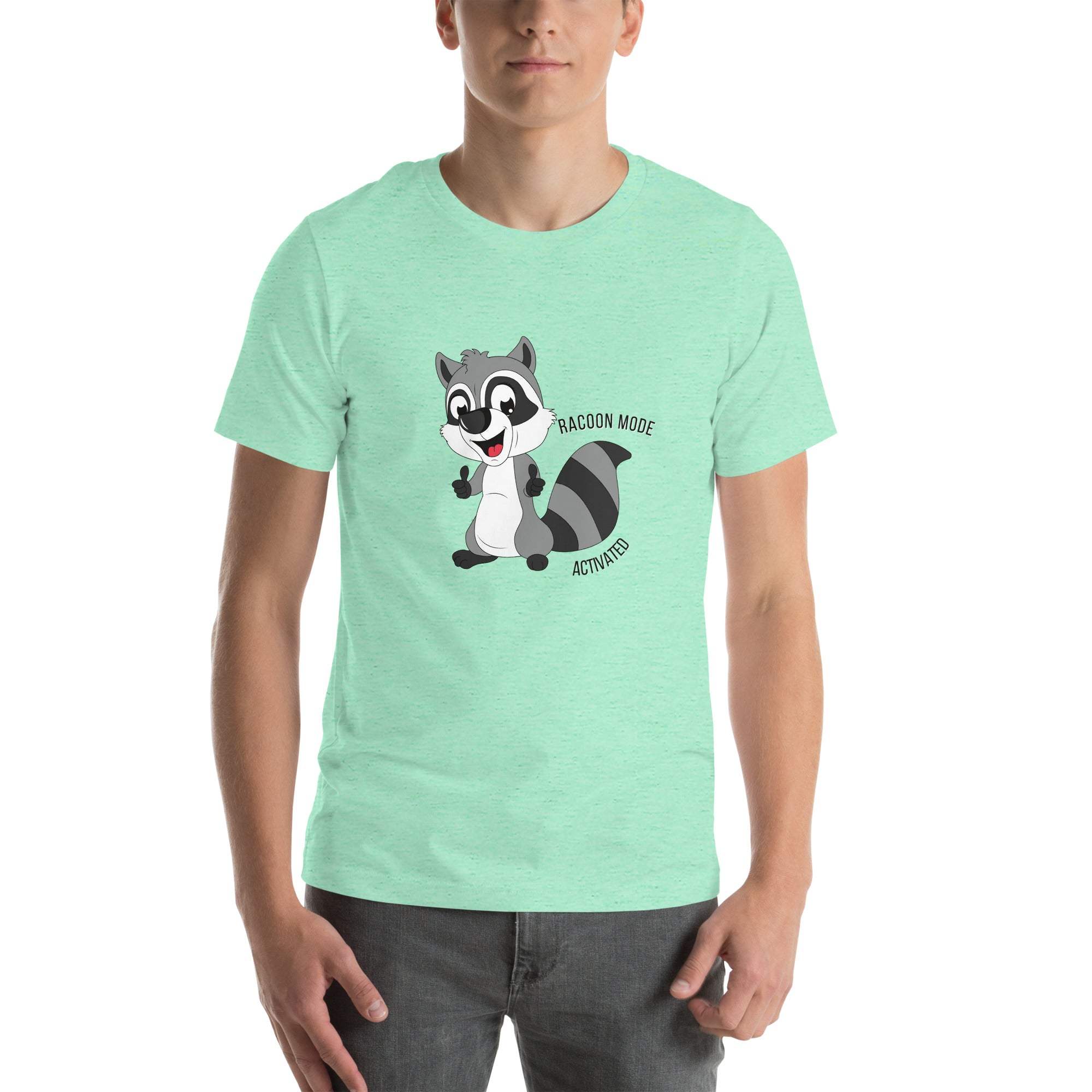 Man wearing mint green Raccoon Mode T-Shirt with cartoon raccoon and "Raccoon Mode Activated" text