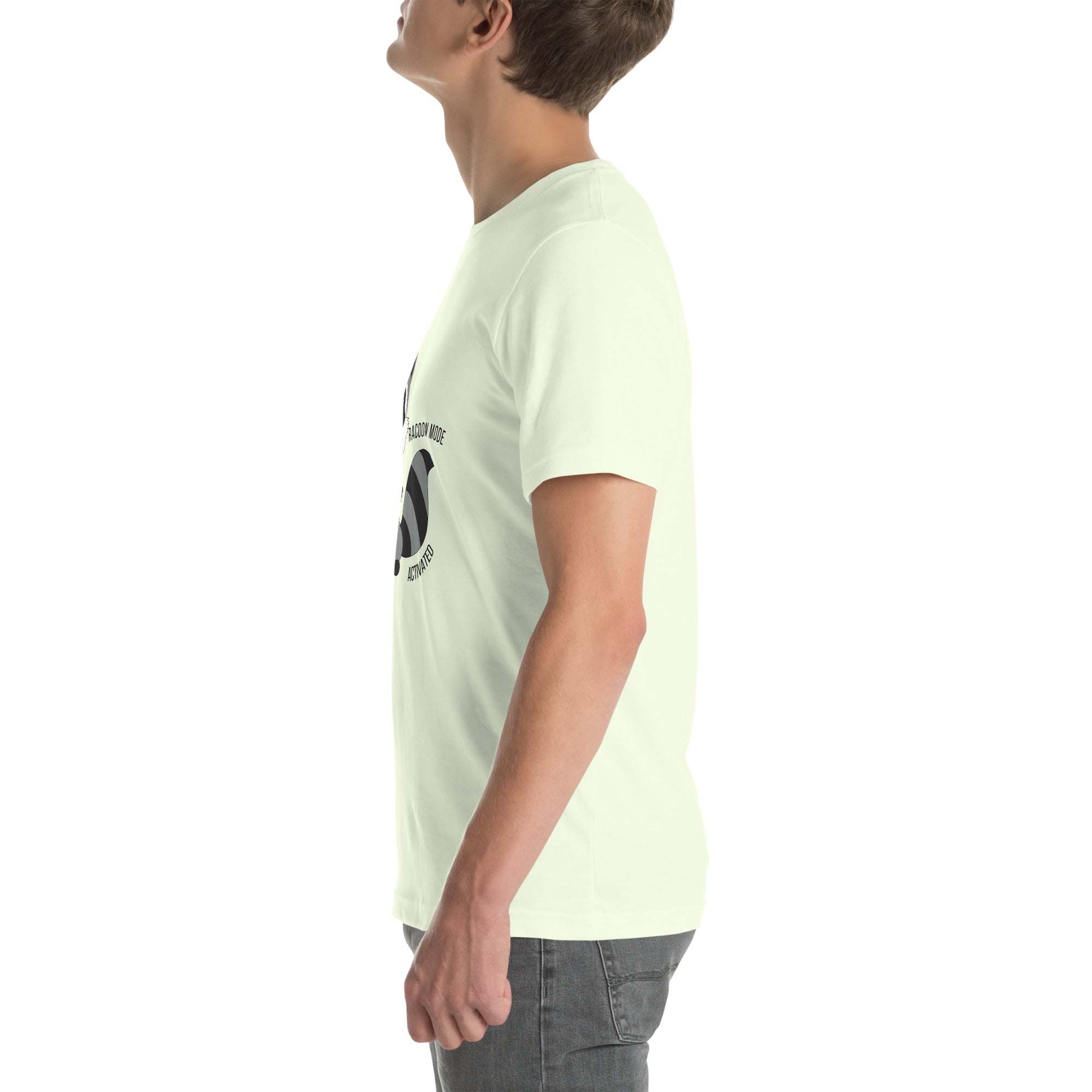 Side view of man wearing white Raccoon Mode T-Shirt with cartoon raccoon design and "Raccoon Mode Activated" text