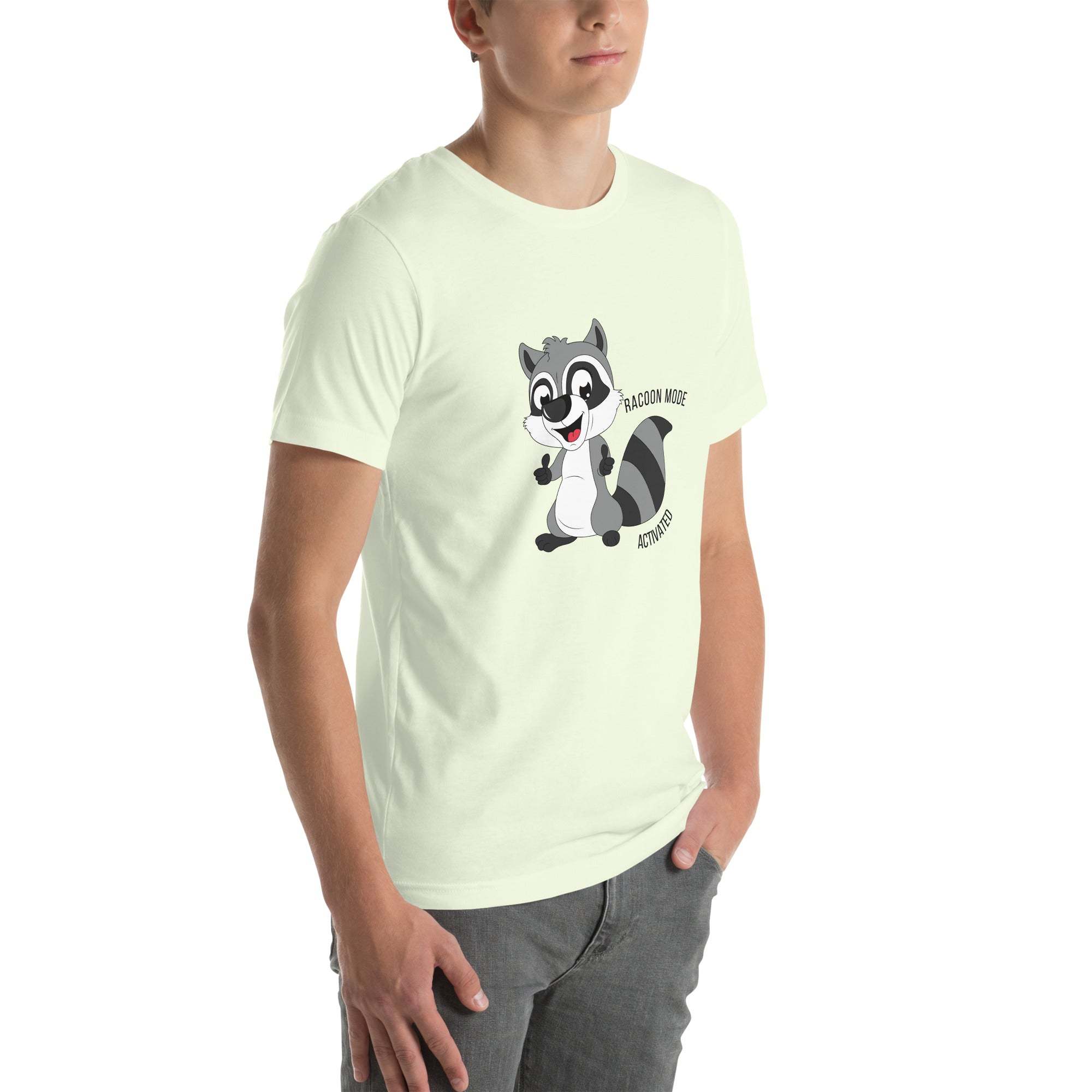 Man wearing light-colored Raccoon Mode T-Shirt with cartoon raccoon and "Raccoon Mode Activated" text