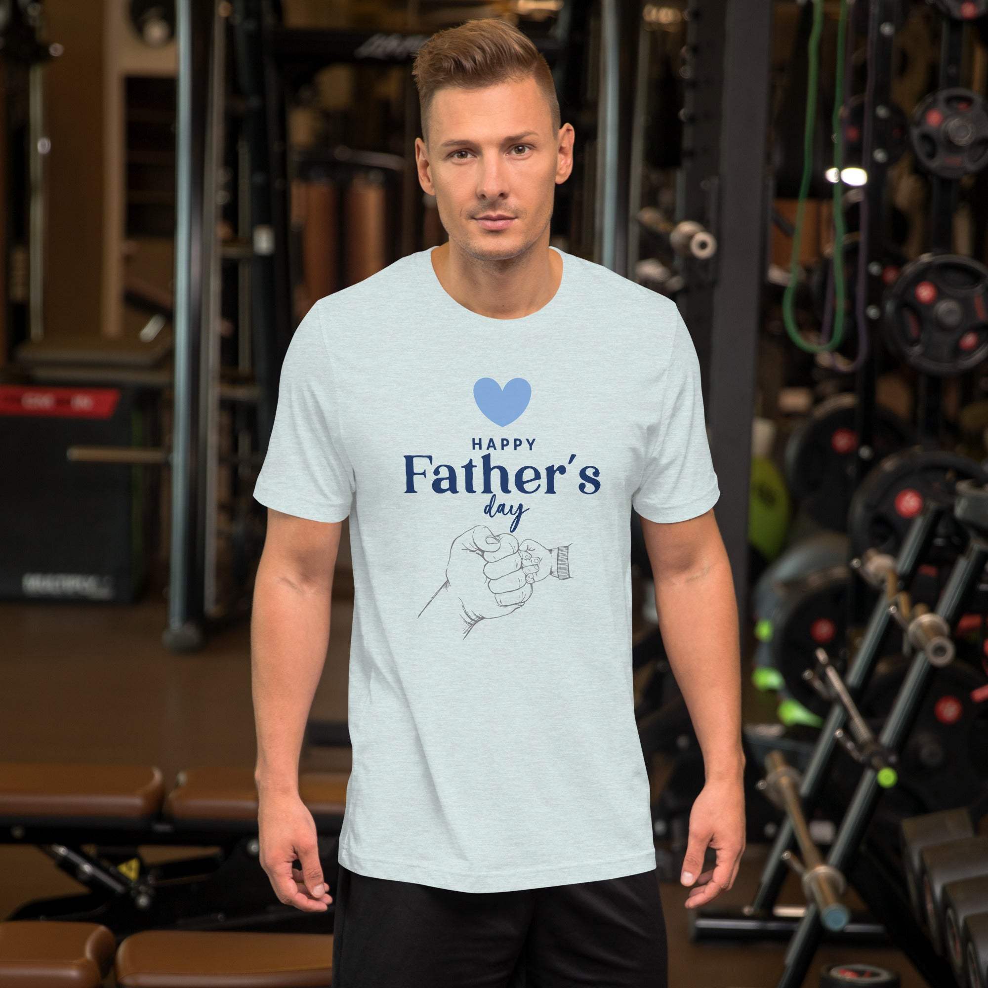 Man wearing light blue Father's Day T-Shirt with heart and hand design in gym