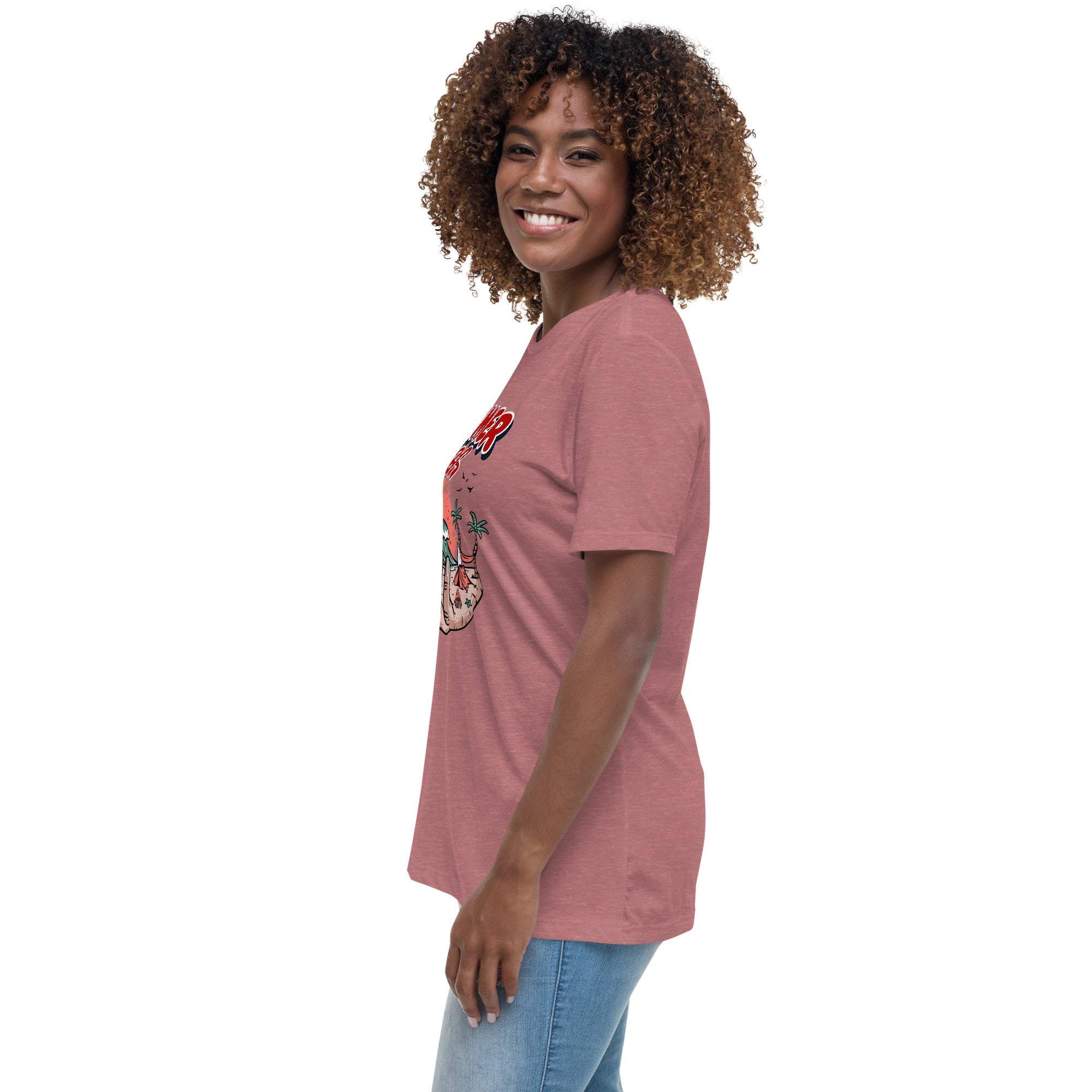 Woman wearing a soft red Summer Vibes T-Shirt with a retro beach graphic on the front, shown in side profile.