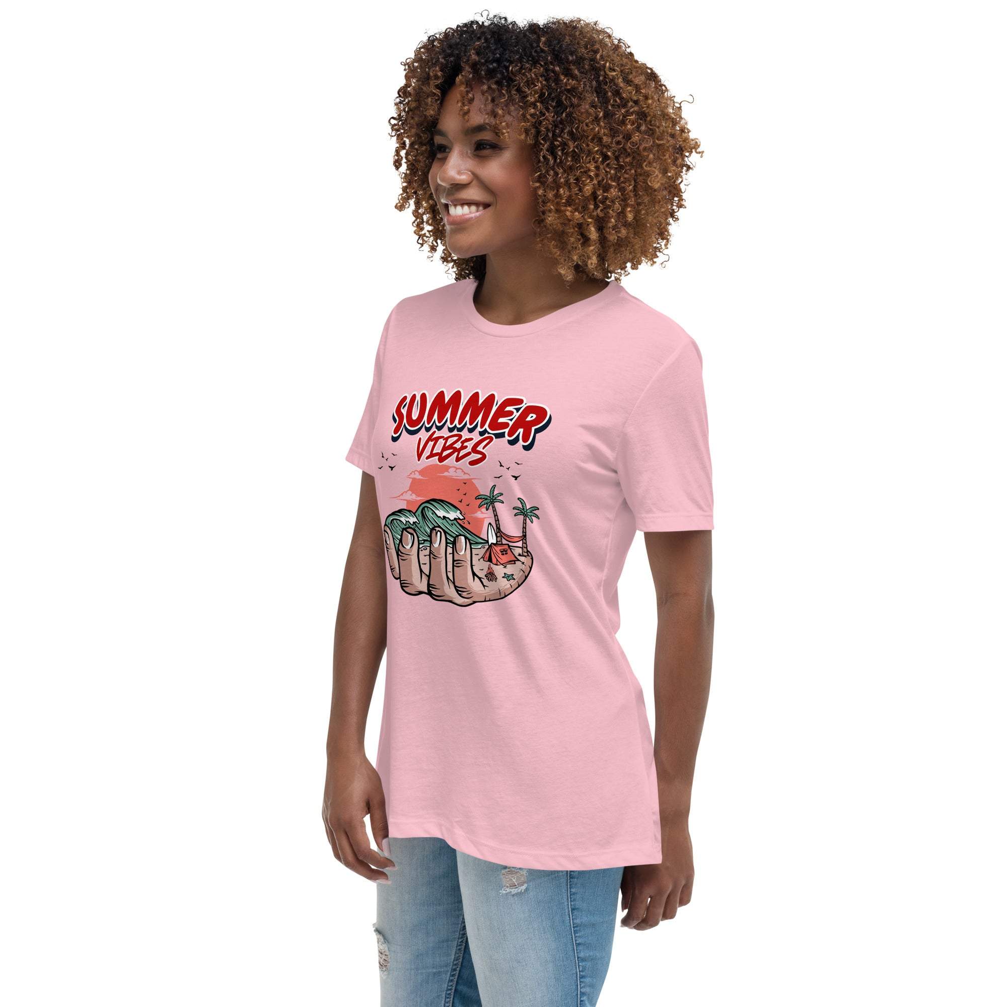 Woman wearing pink Summer Vibes T-Shirt with retro beach graphic of hand holding waves and palm trees.