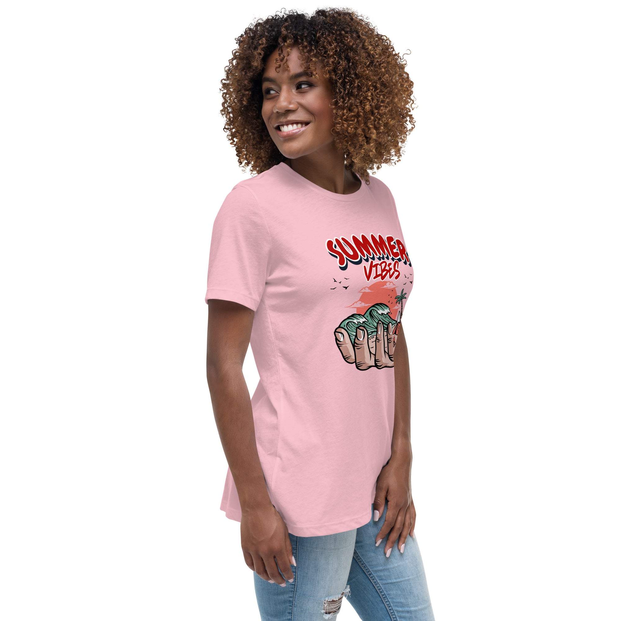 Woman wearing pink Summer Vibes T-Shirt with retro beach graphic and casual jeans