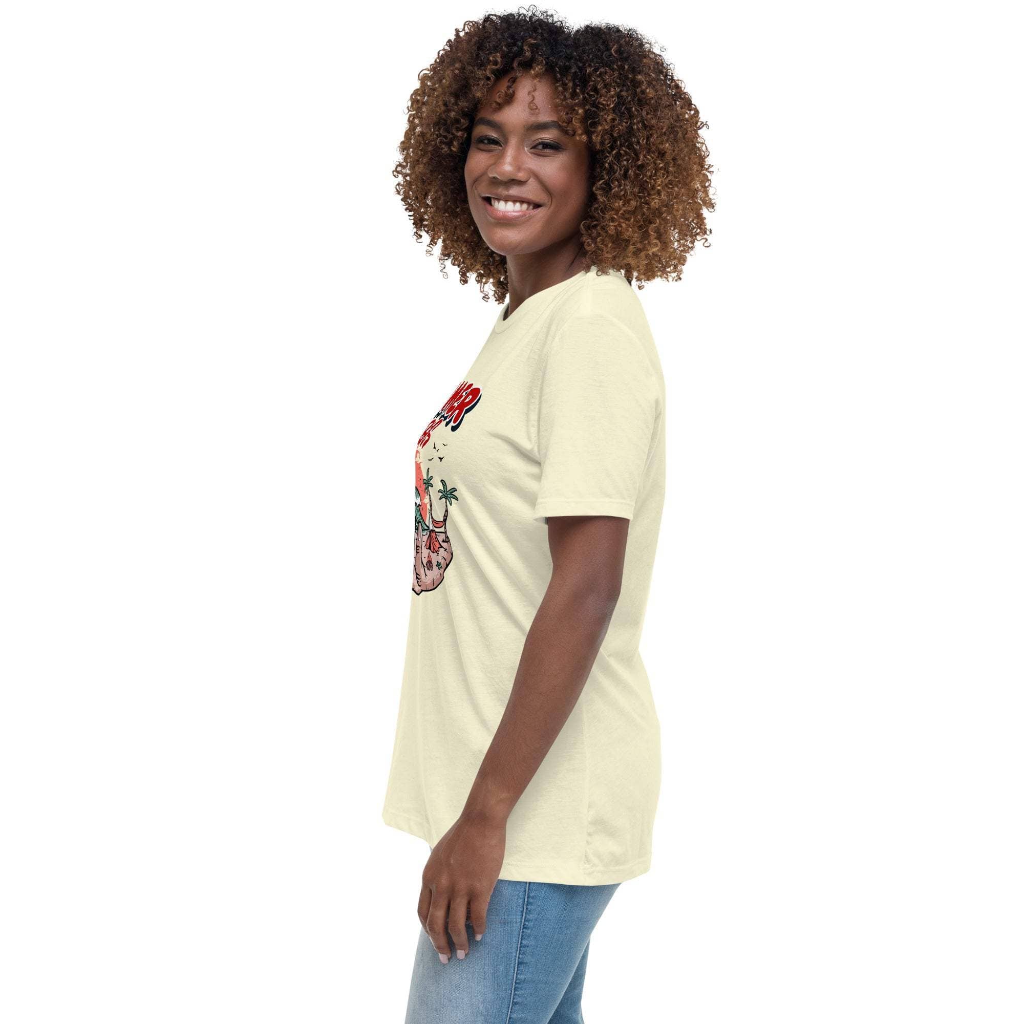 Woman wearing a light yellow Summer Vibes T-Shirt with a retro beach graphic on the front, paired with blue jeans.