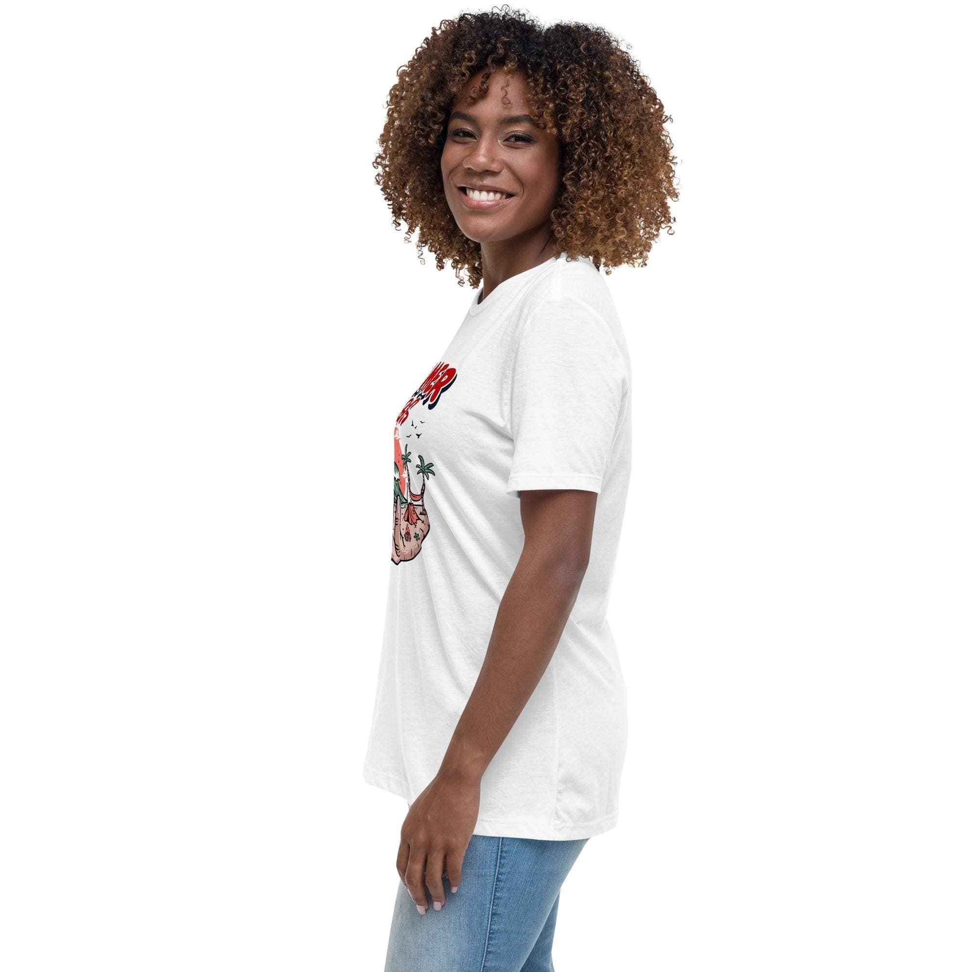 Woman wearing white Summer Vibes T-Shirt with retro beach graphic and short sleeves standing sideways smiling.