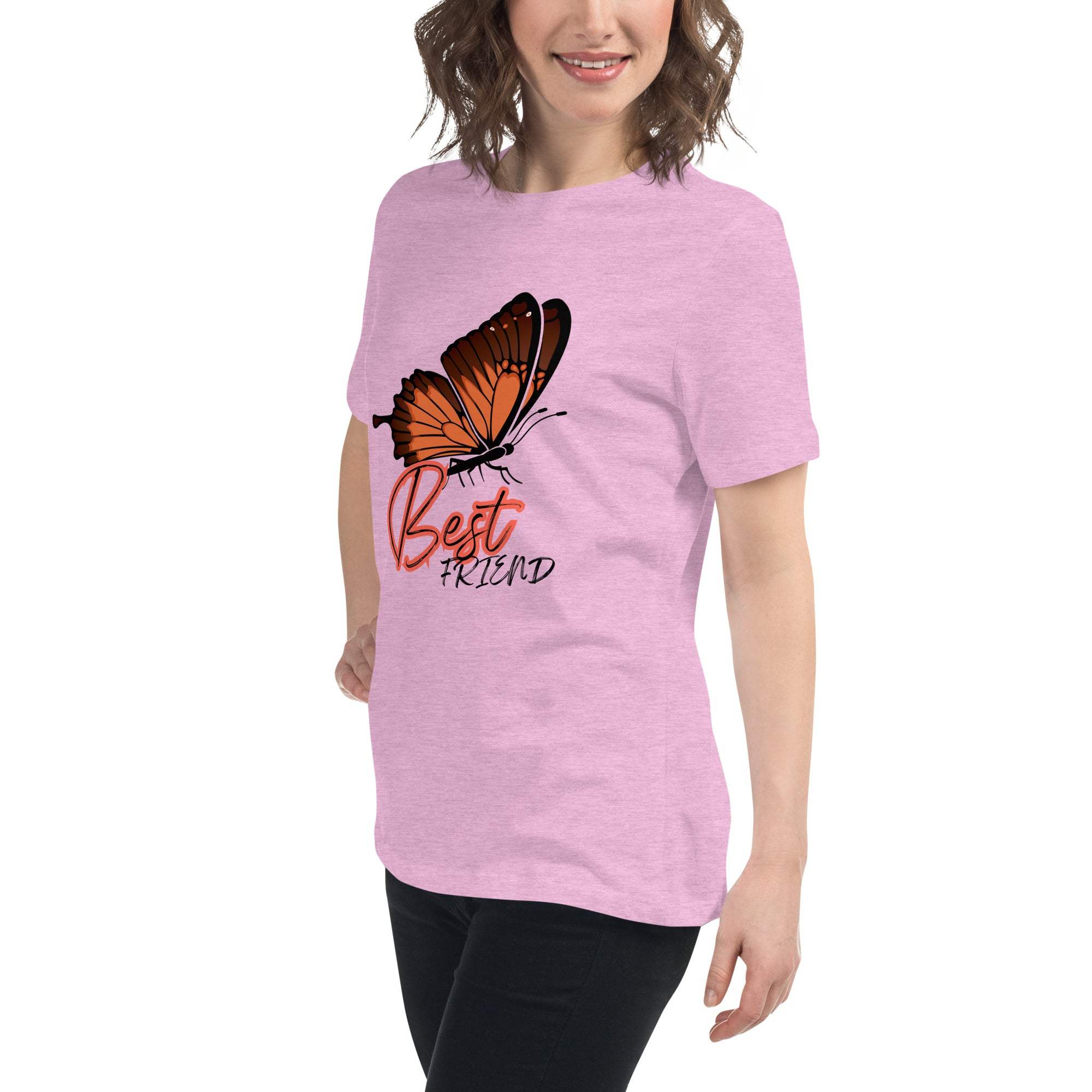 Woman wearing a pink Best Friend Butterfly T-Shirt with an orange butterfly graphic and black text, styled casually with black pants.