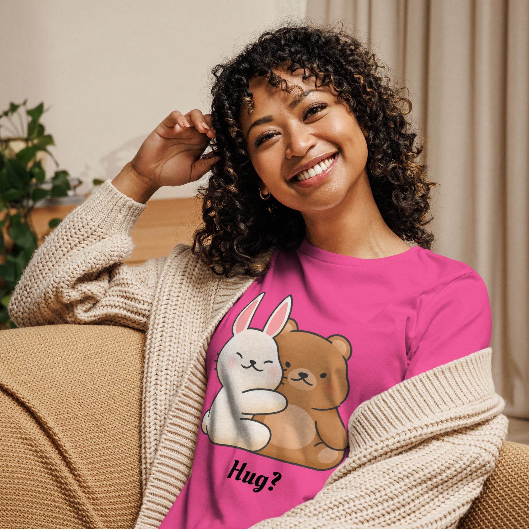 Woman wearing a bright pink Cute Bunny and Bear Hug T-Shirt featuring a kawaii cartoon bunny and bear hugging with the word "Hug?" beneath the design.