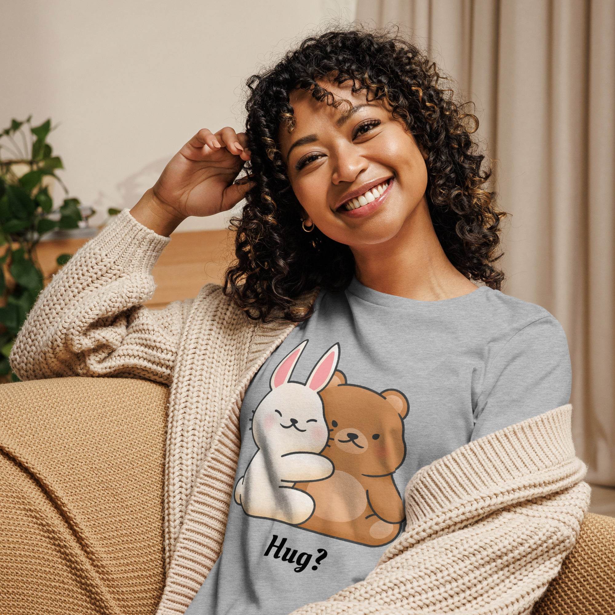 Woman wearing gray Cute Bunny and Bear Hug T-Shirt with a cartoon bunny hugging a bear and text "Hug?"