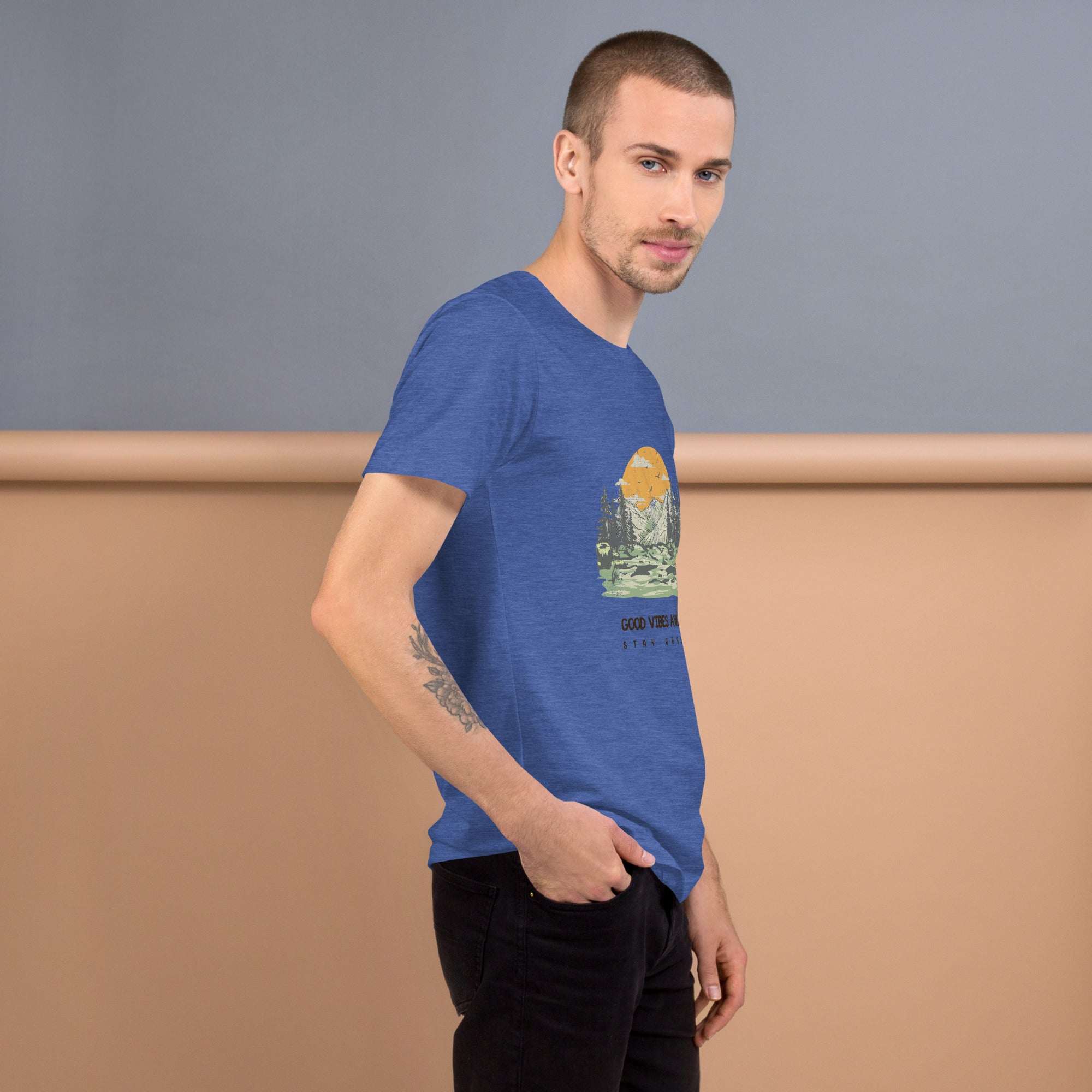 Man wearing blue Good Vibes T-Shirt with nature graphic, soft and lightweight cotton material