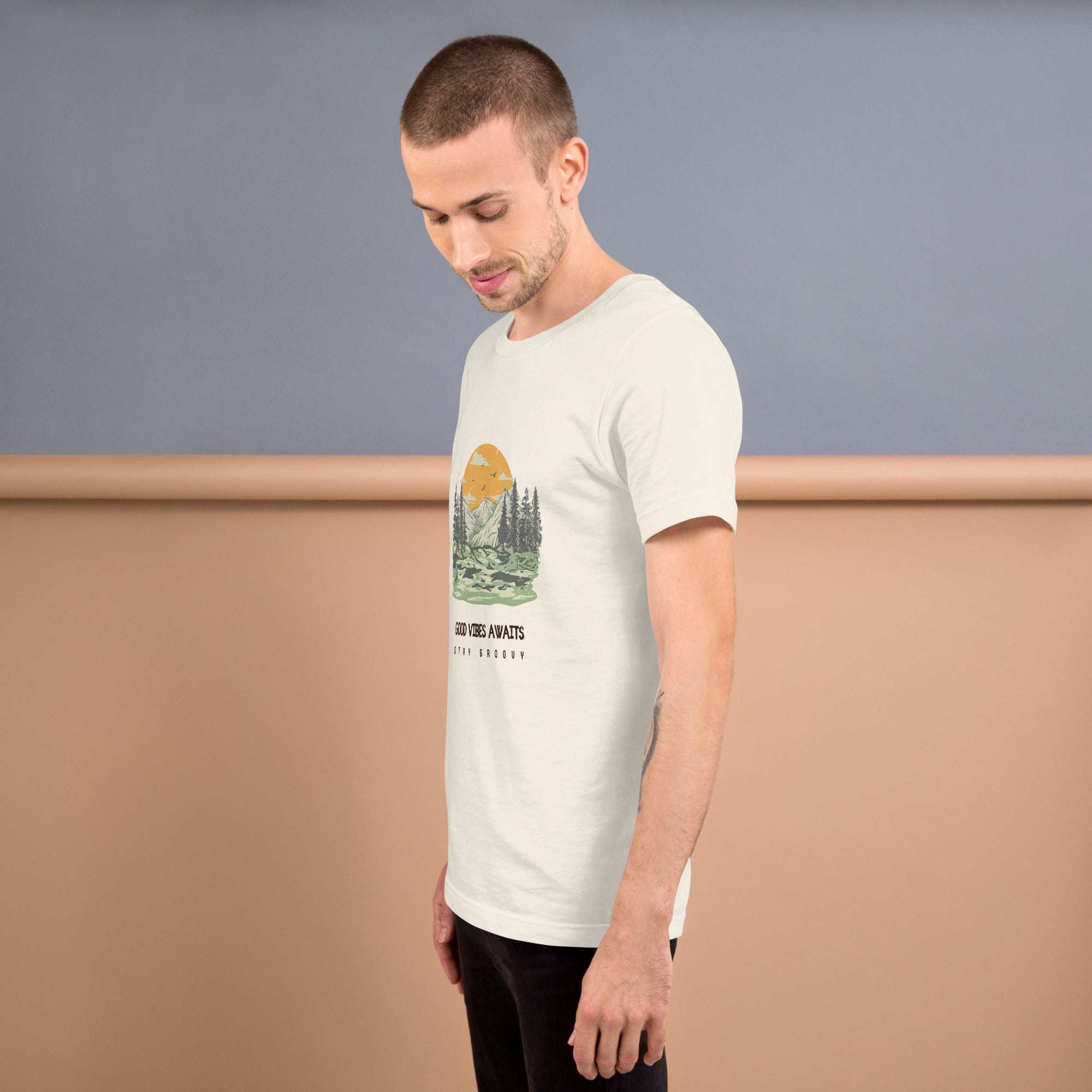 Man wearing Good Vibes Awaits T-Shirt with nature graphic, soft lightweight cotton blend, comfortable fit