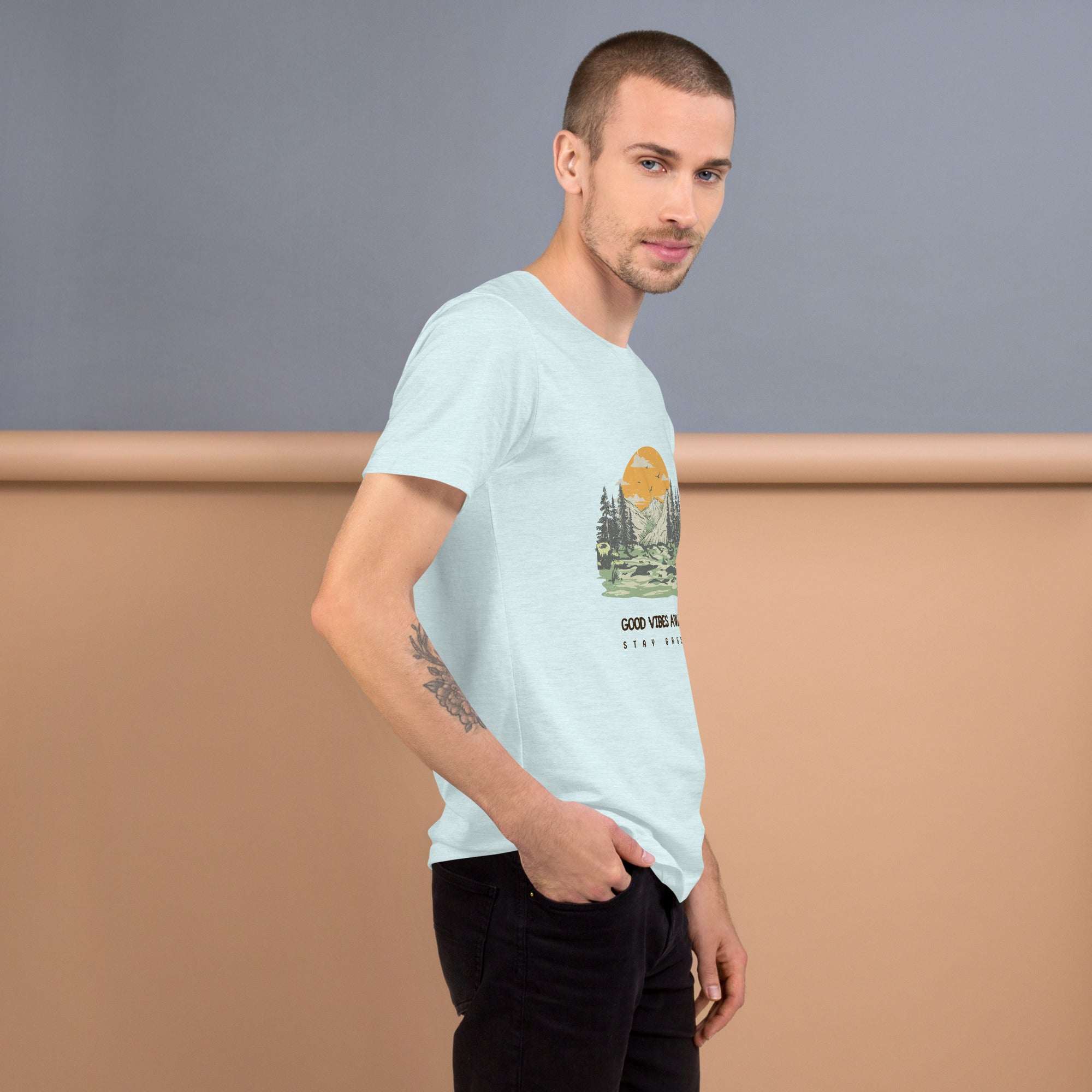 Man wearing light blue Good Vibes T-Shirt with nature graphic, soft cotton, comfortable fit
