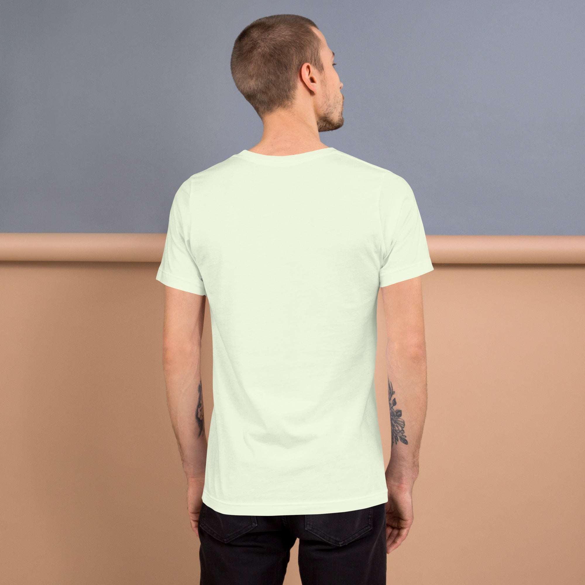 Man wearing a light-colored Good Vibes T-Shirt viewed from the back, showing a soft, lightweight fabric with a comfortable fit