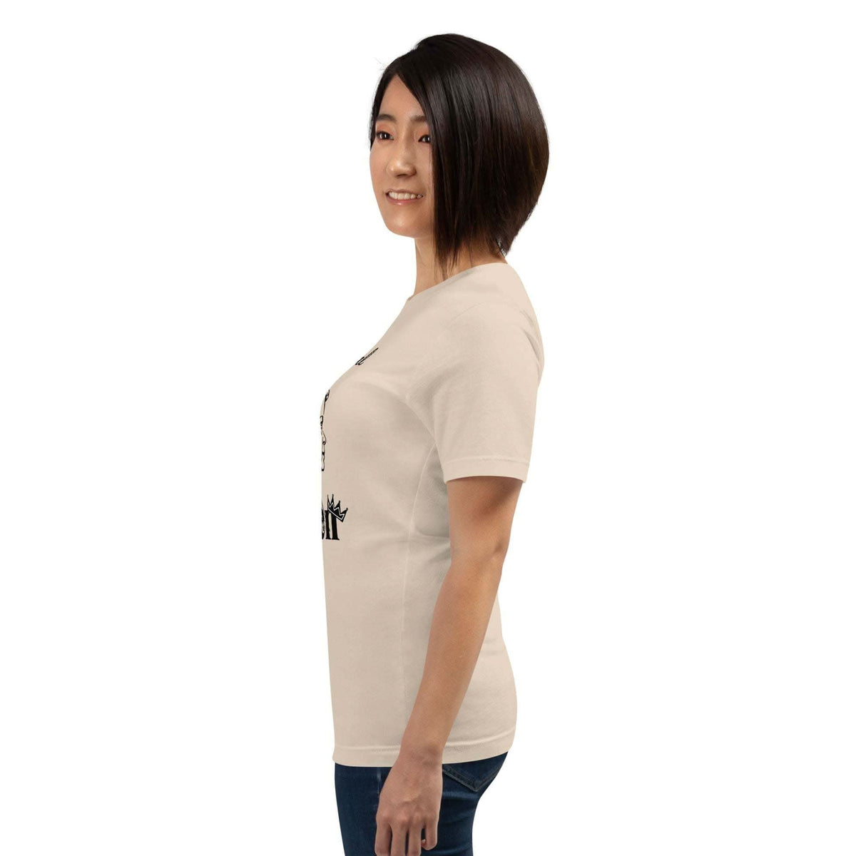 Woman wearing beige Real Queen T-Shirt with crown graphic and statement text, side view