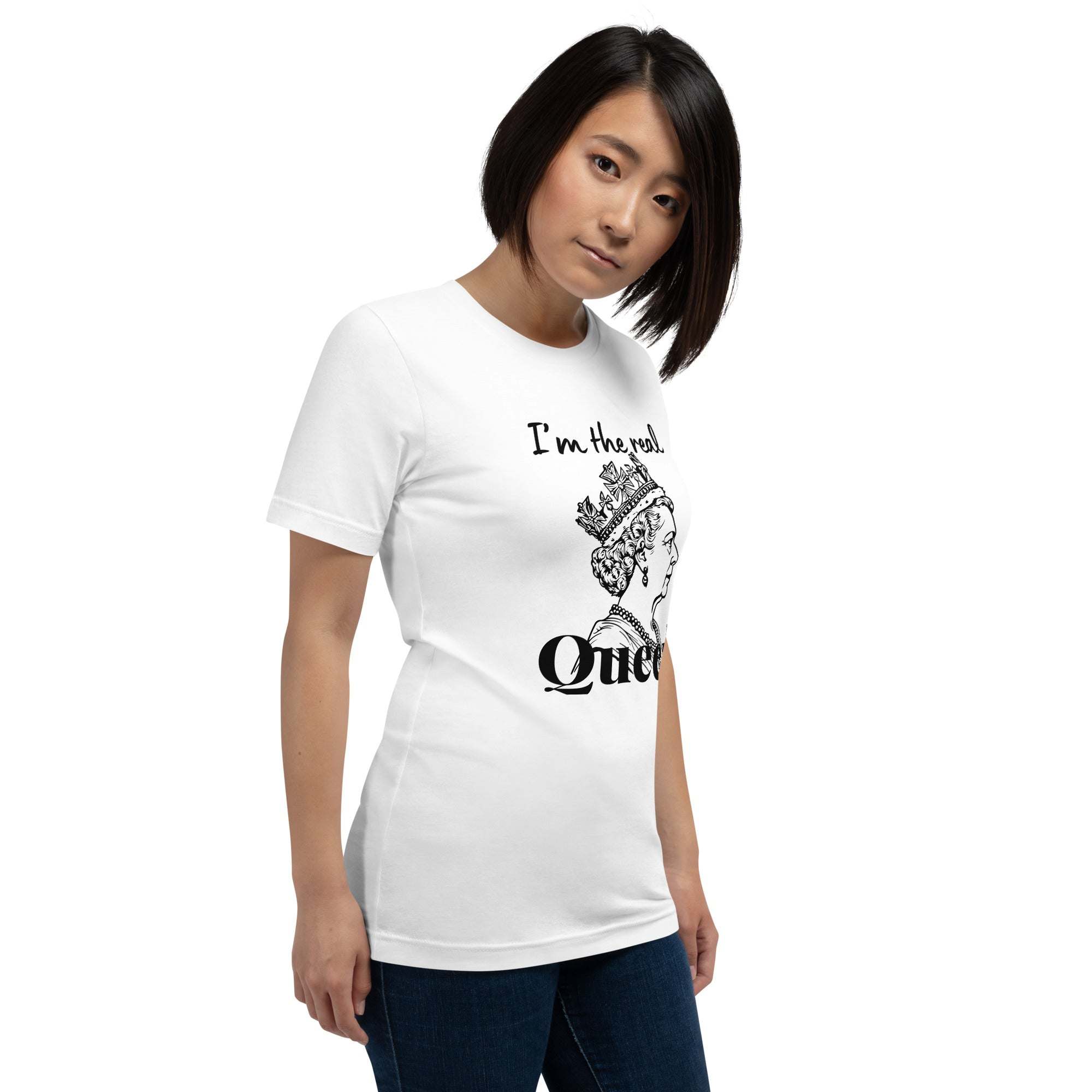 Woman wearing white Real Queen T-Shirt with crown graphic and statement text, styled casually with jeans.