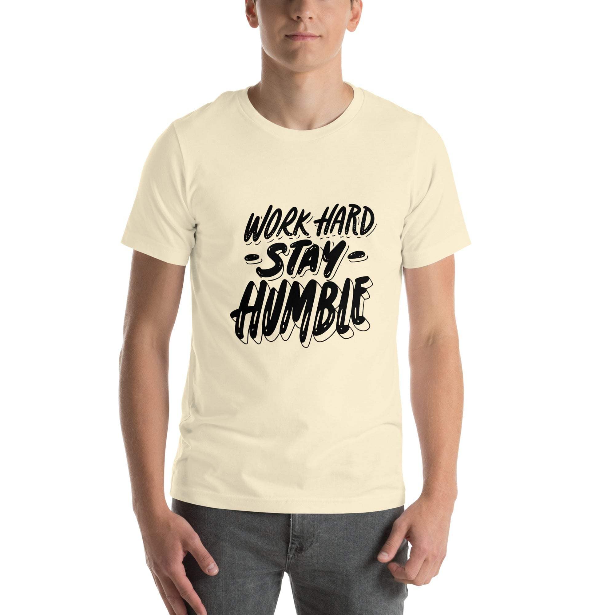 Man wearing cream Work Hard Stay Humble T-Shirt with motivational text design