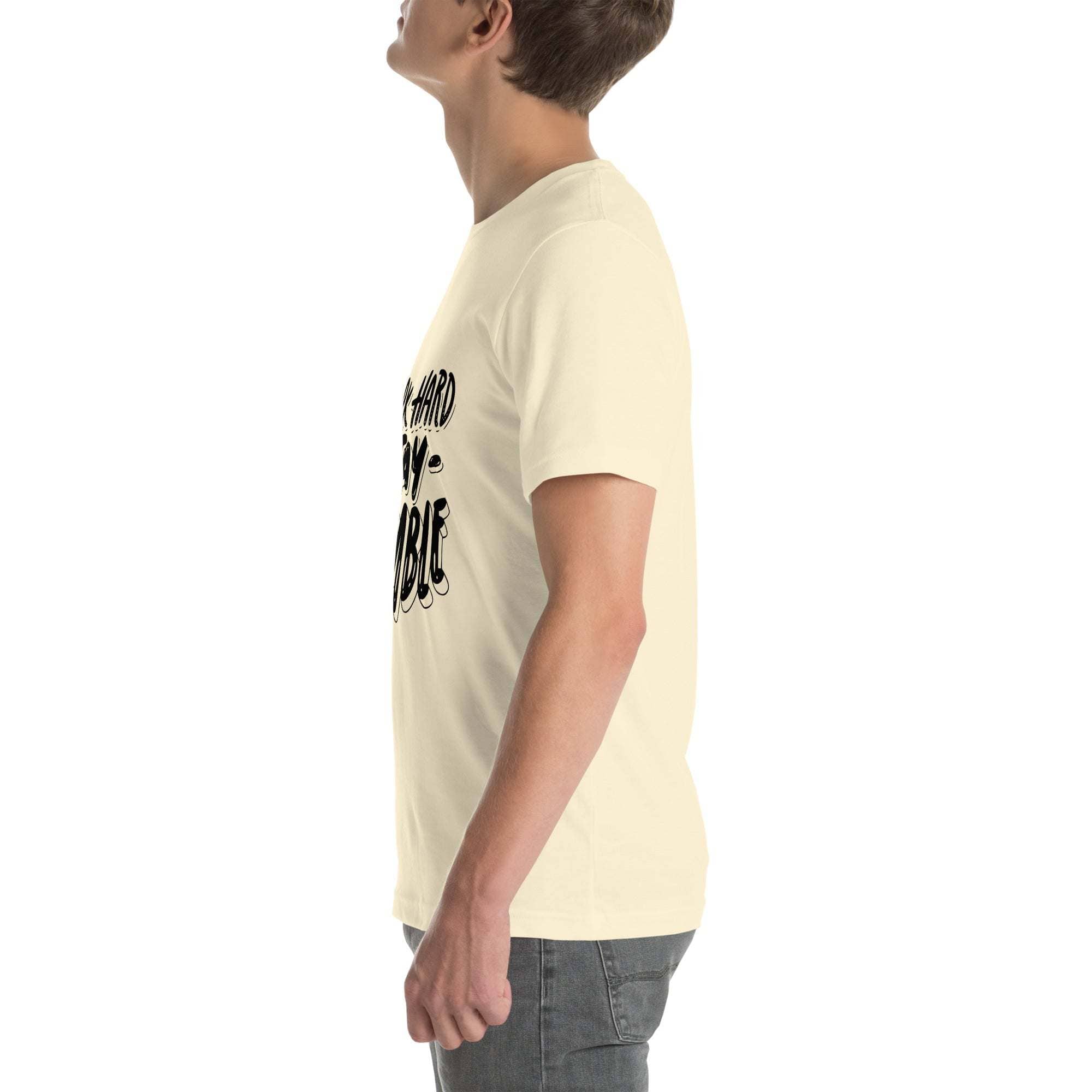 Side view of man wearing beige Work Hard T-Shirt with motivational quote graphic design