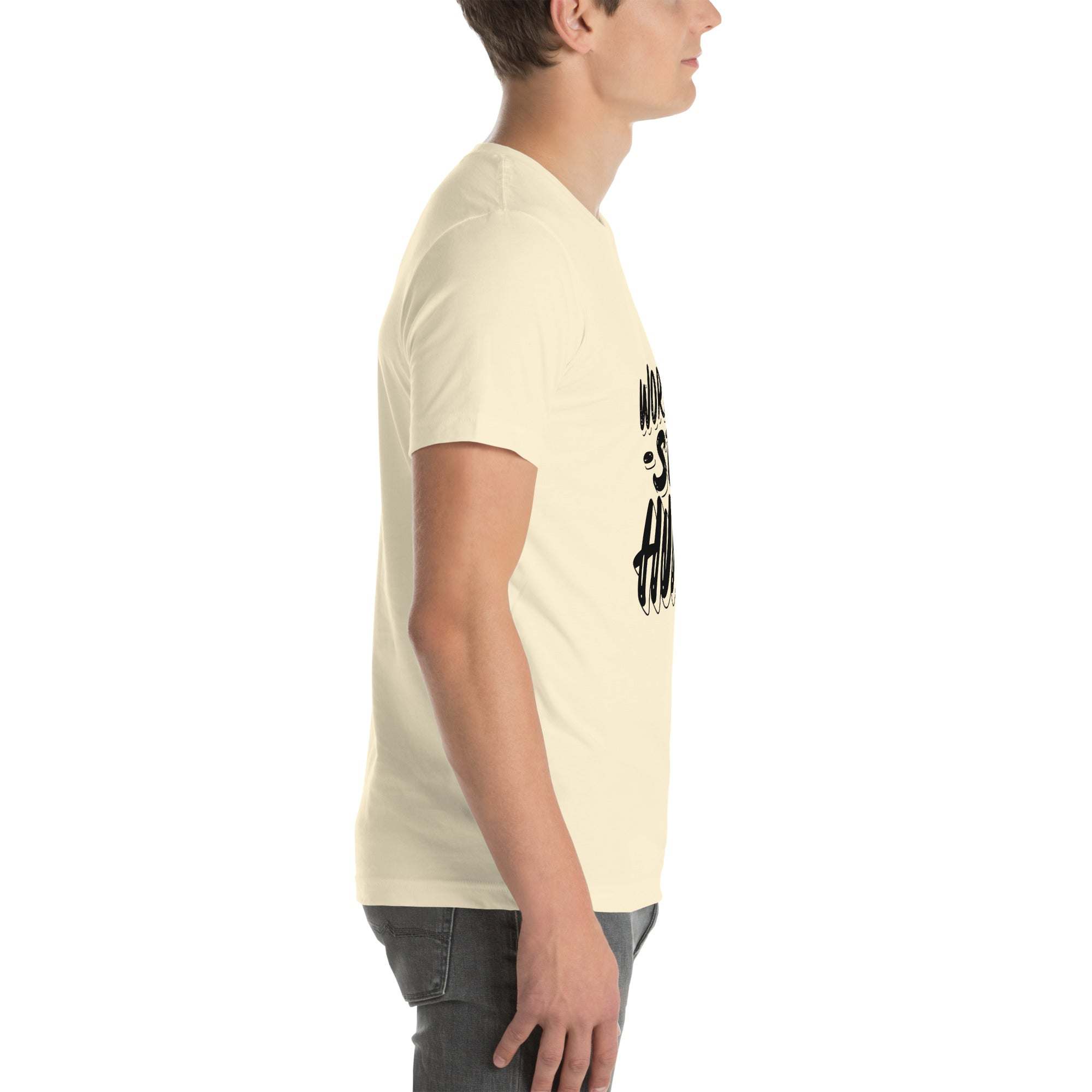 Side view of man wearing cream Work Hard Stay Humble T-Shirt with motivational graphic design