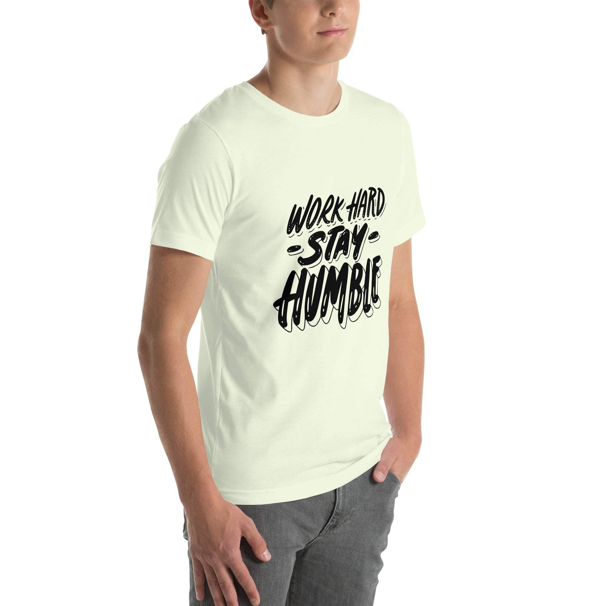 Young man wearing a white Work Hard Stay Humble T-Shirt with black motivational text design