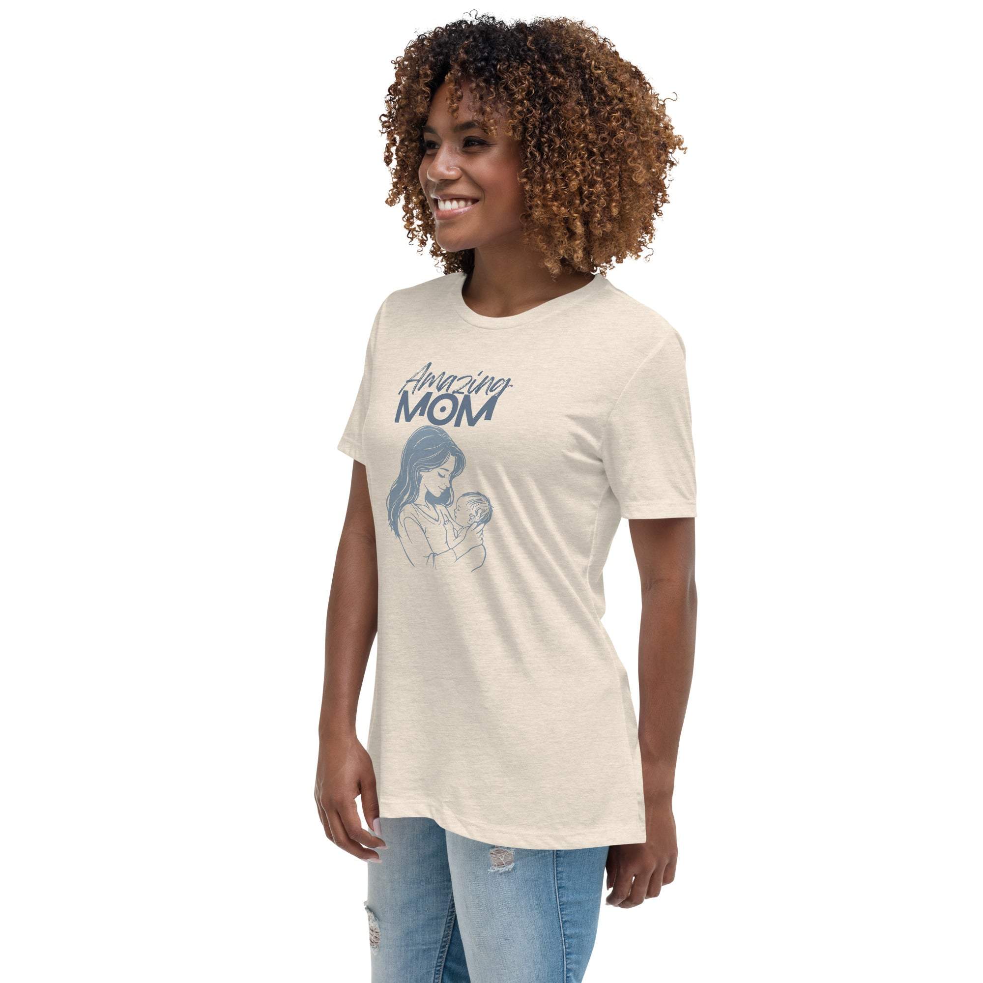 Woman wearing beige Amazing Mom T-Shirt with mother and baby graphic and text design