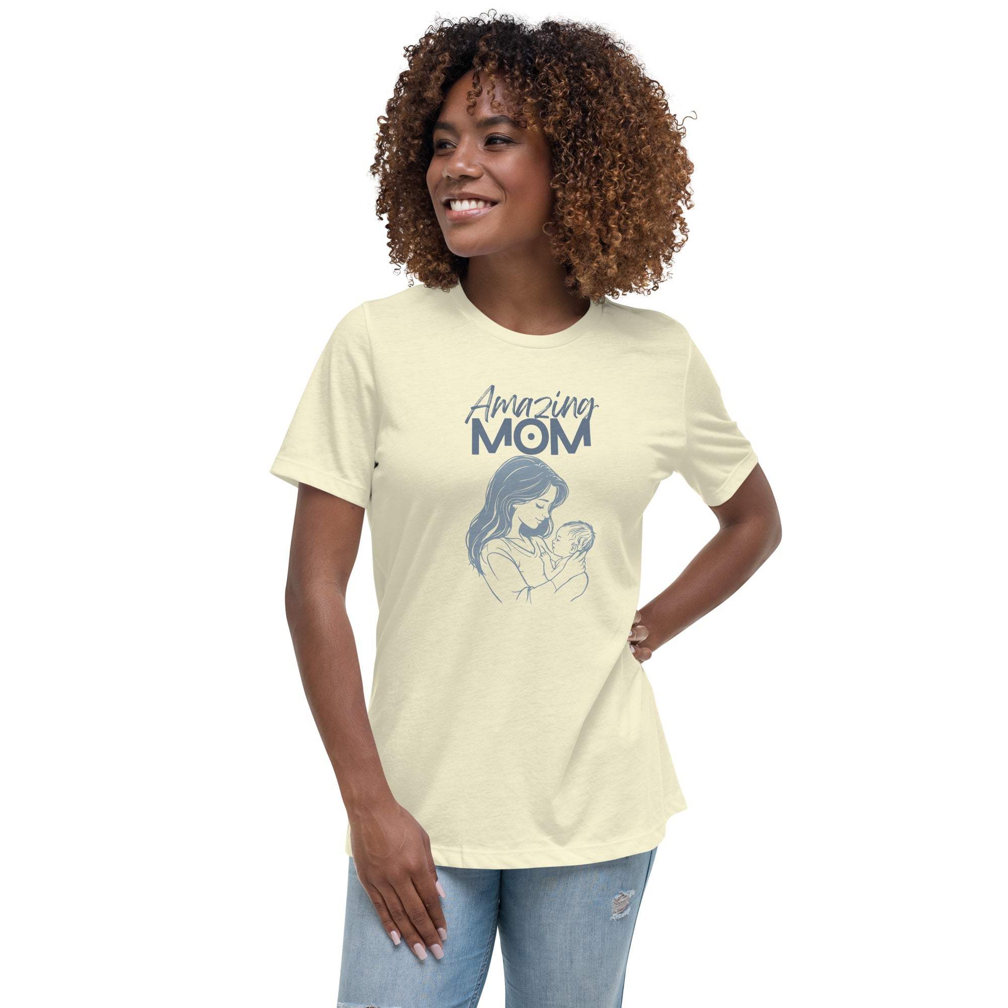 Woman wearing a soft cotton cream Amazing Mom T-shirt with a mother and baby graphic and casual jeans