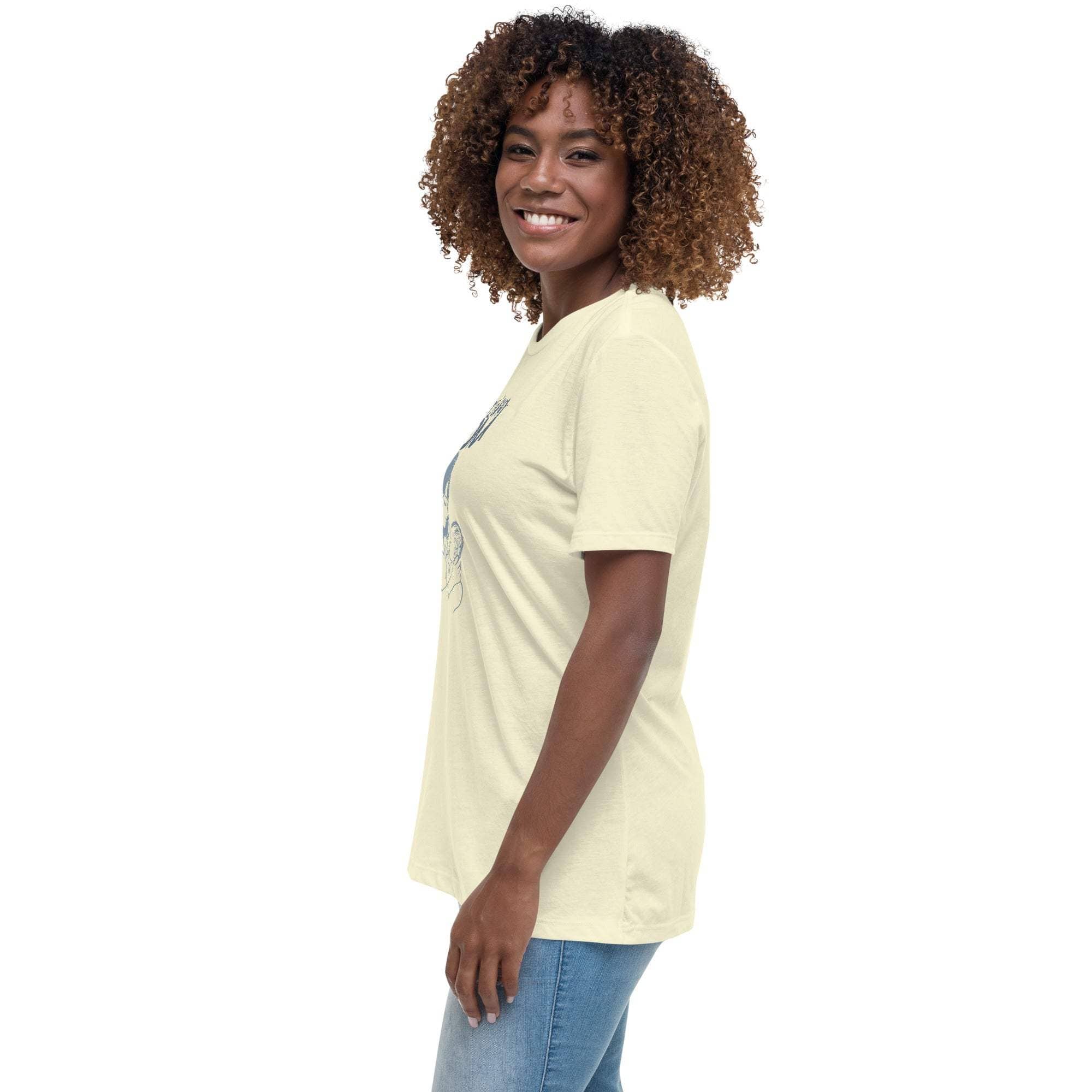 Smiling woman wearing a beige Amazing Mom T-Shirt in a relaxed fit, paired with blue jeans, side view.