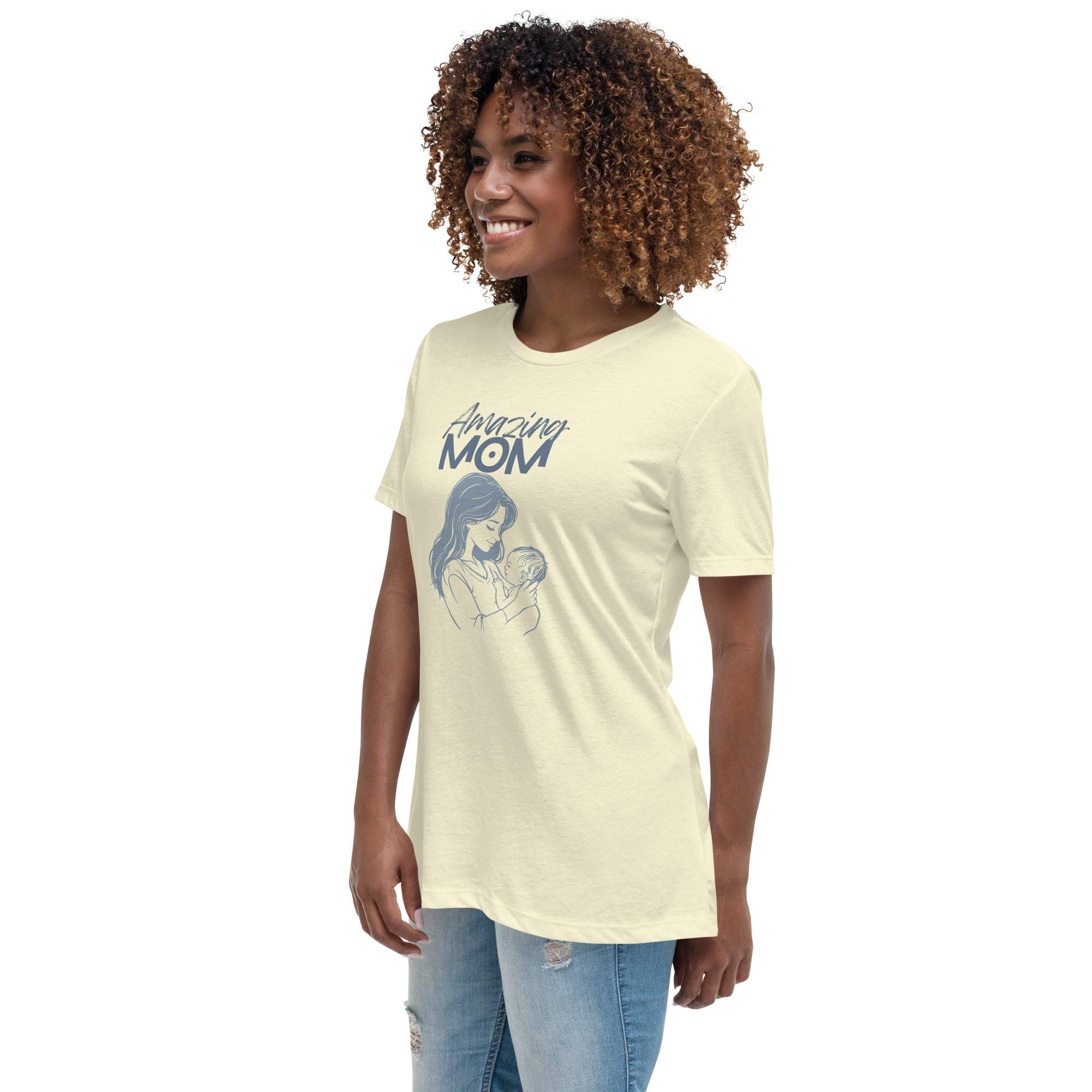 Woman wearing a cream "Amazing Mom" t-shirt with a mother and baby graphic, paired with ripped jeans