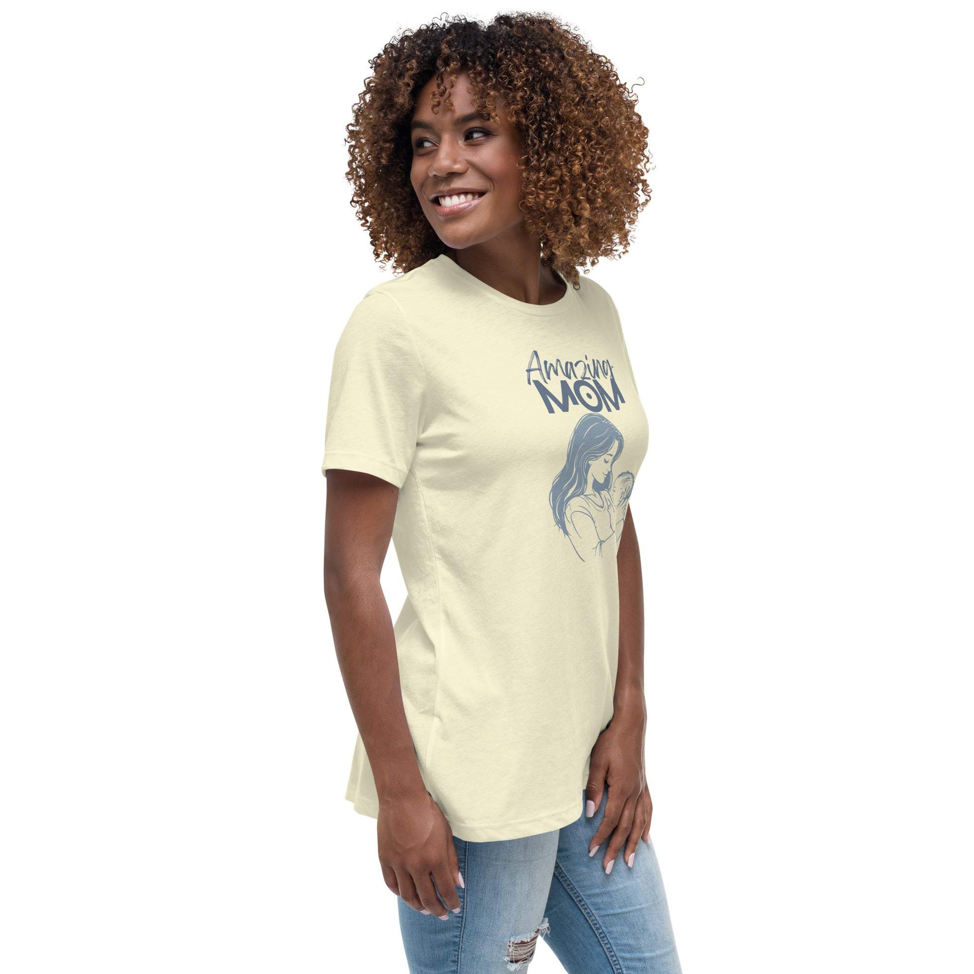 Woman wearing a soft cotton beige Amazing Mom t-shirt with a mother and child graphic, styled casually with jeans.