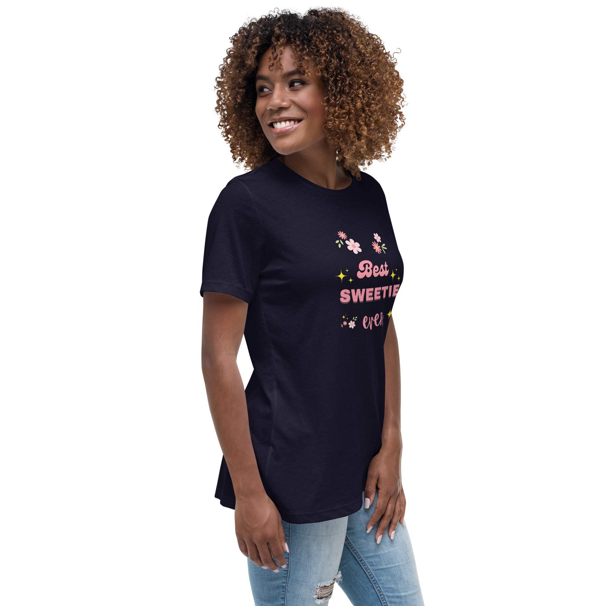 Woman wearing navy blue "Best Sweetie Ever" t-shirt with floral and star design, paired with jeans.