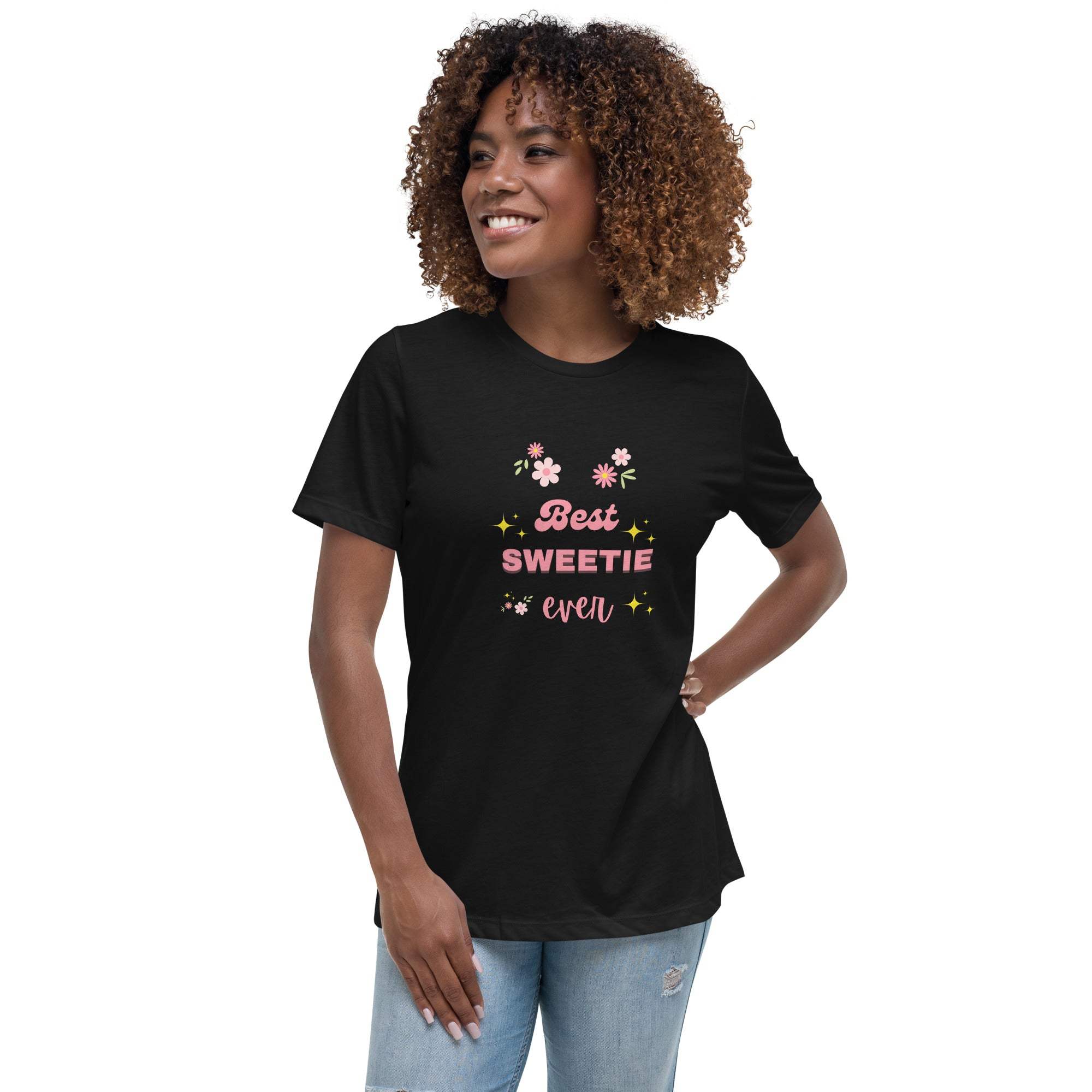 Woman wearing black "Best Sweetie Ever" floral graphic t-shirt with pink and yellow design and casual jeans