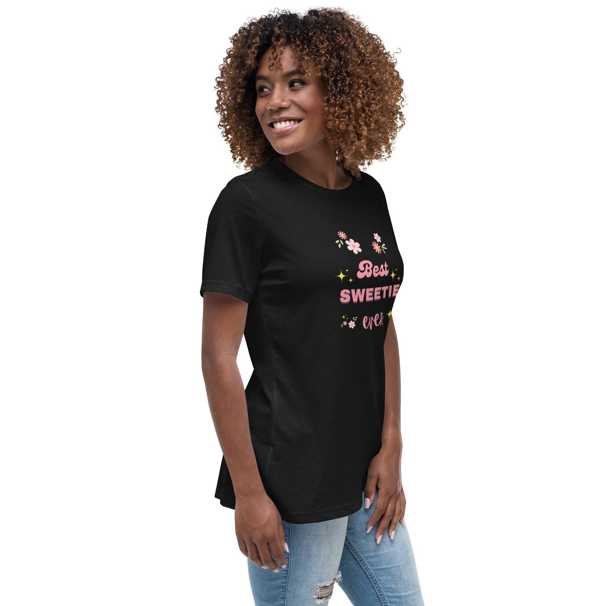 Woman wearing black "Best Sweetie Ever" t-shirt with floral and star design, paired with light blue jeans.