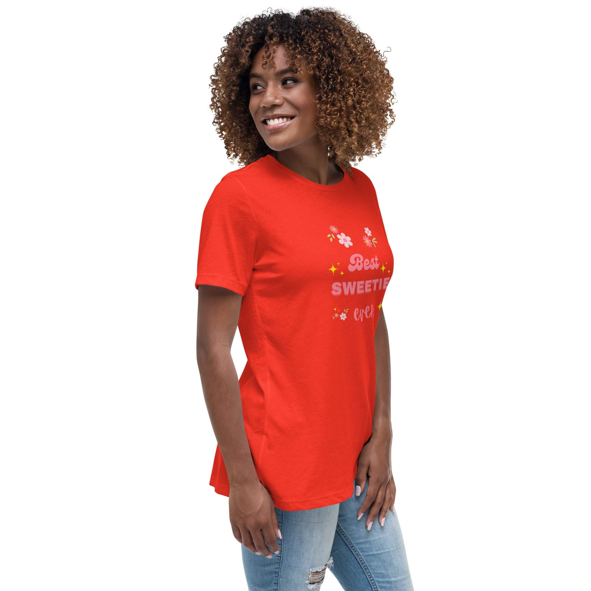 Woman wearing red "Best Sweetie Ever" t-shirt with floral and star design, paired with jeans