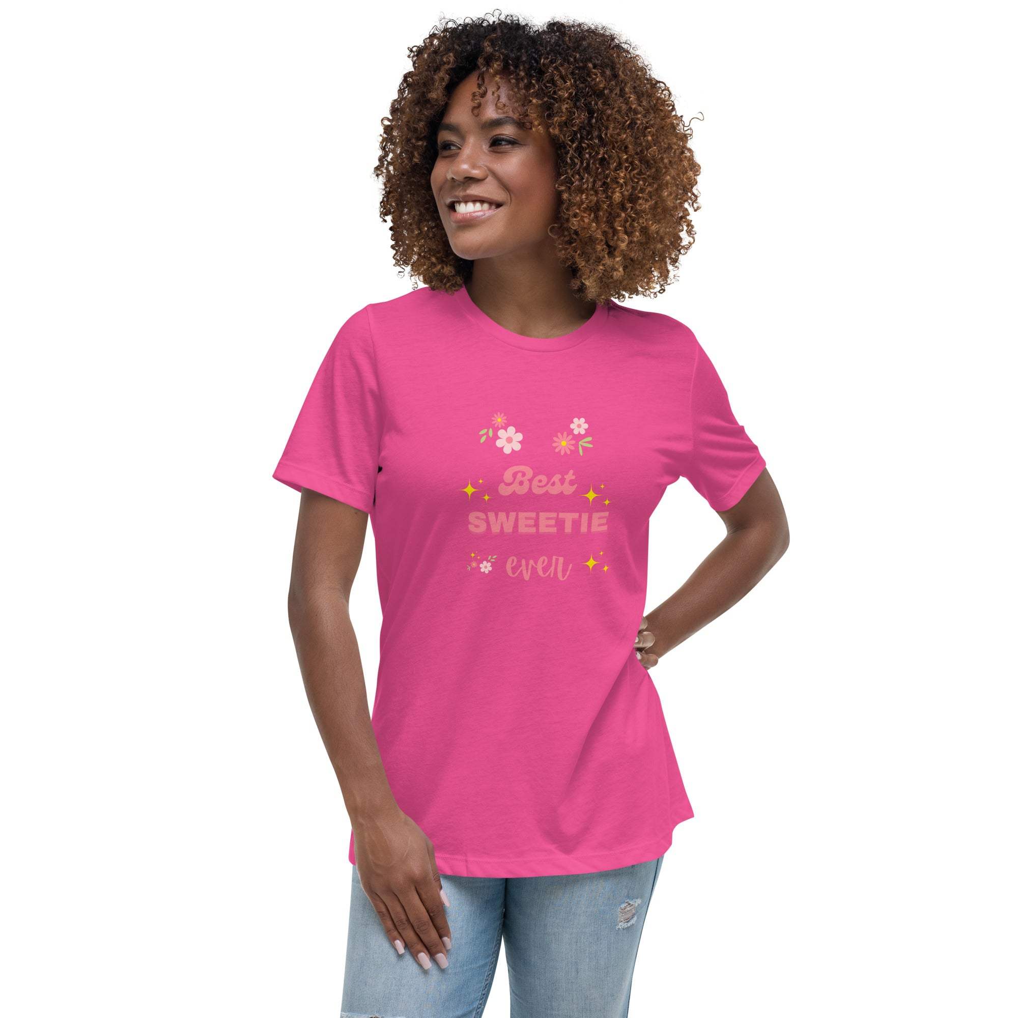 Woman wearing a pink "Best Sweetie Ever" t-shirt with floral and star designs paired with jeans