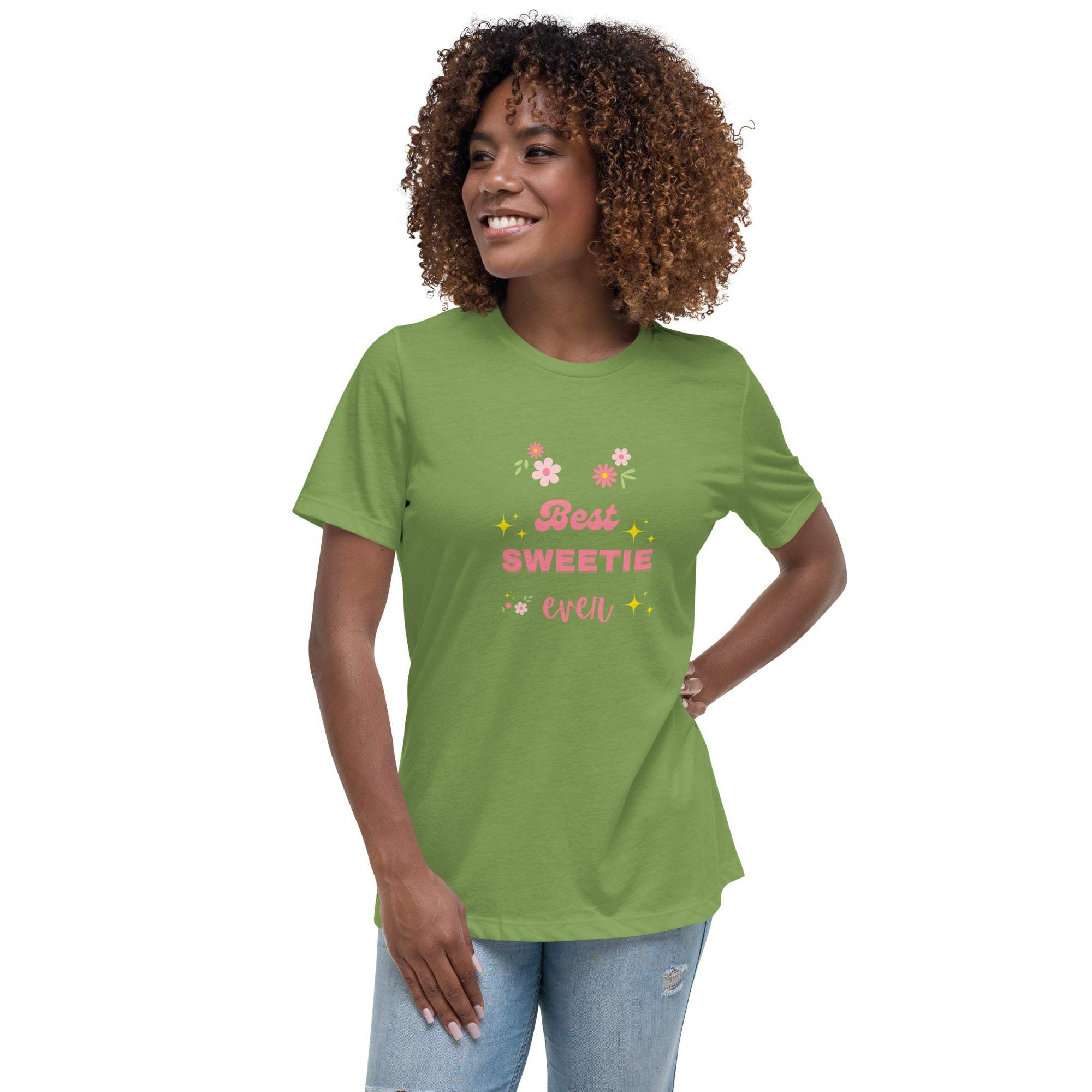 Woman wearing green Best Sweetie Ever t-shirt with floral and star accents, paired with blue jeans