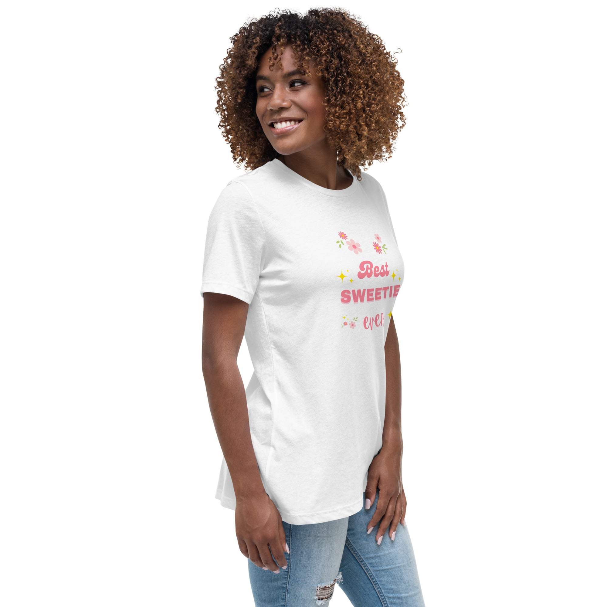 Woman wearing white Best Sweetie Ever t-shirt with floral and star accents paired with blue jeans