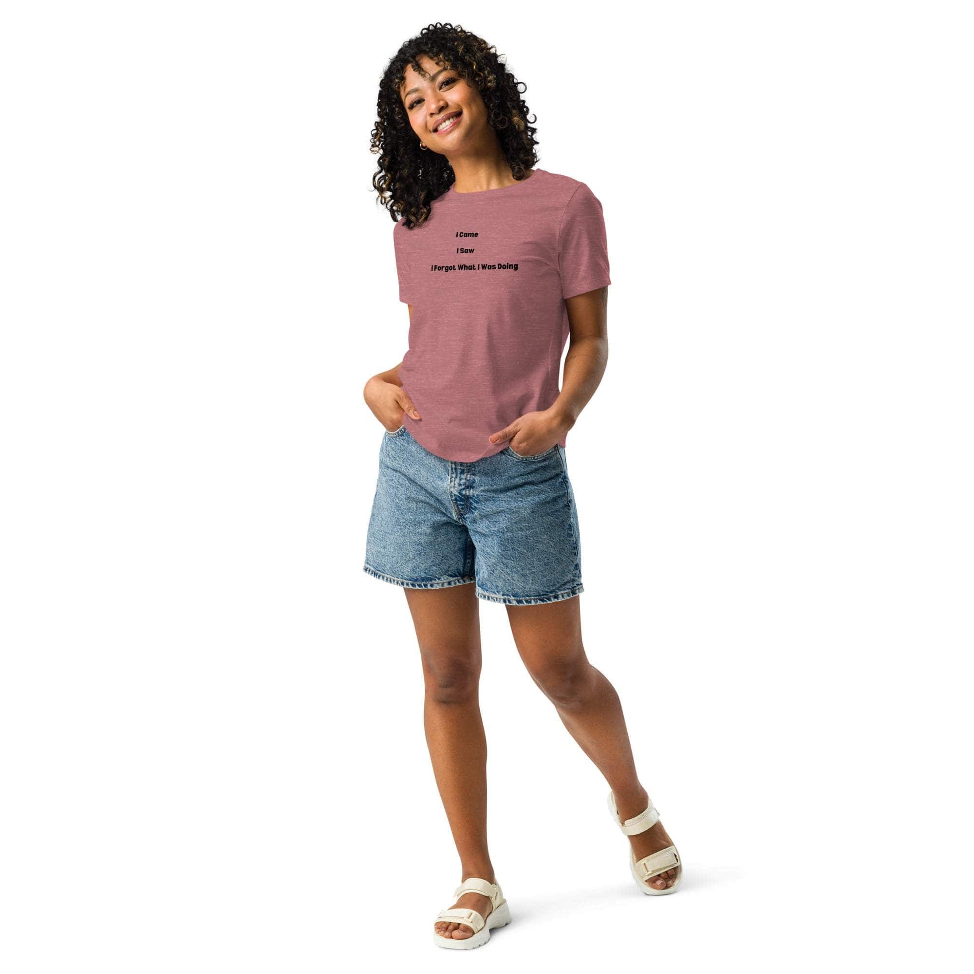 Woman wearing pink "I Came I Saw I Forgot" sarcastic t-shirt with denim shorts and white sandals