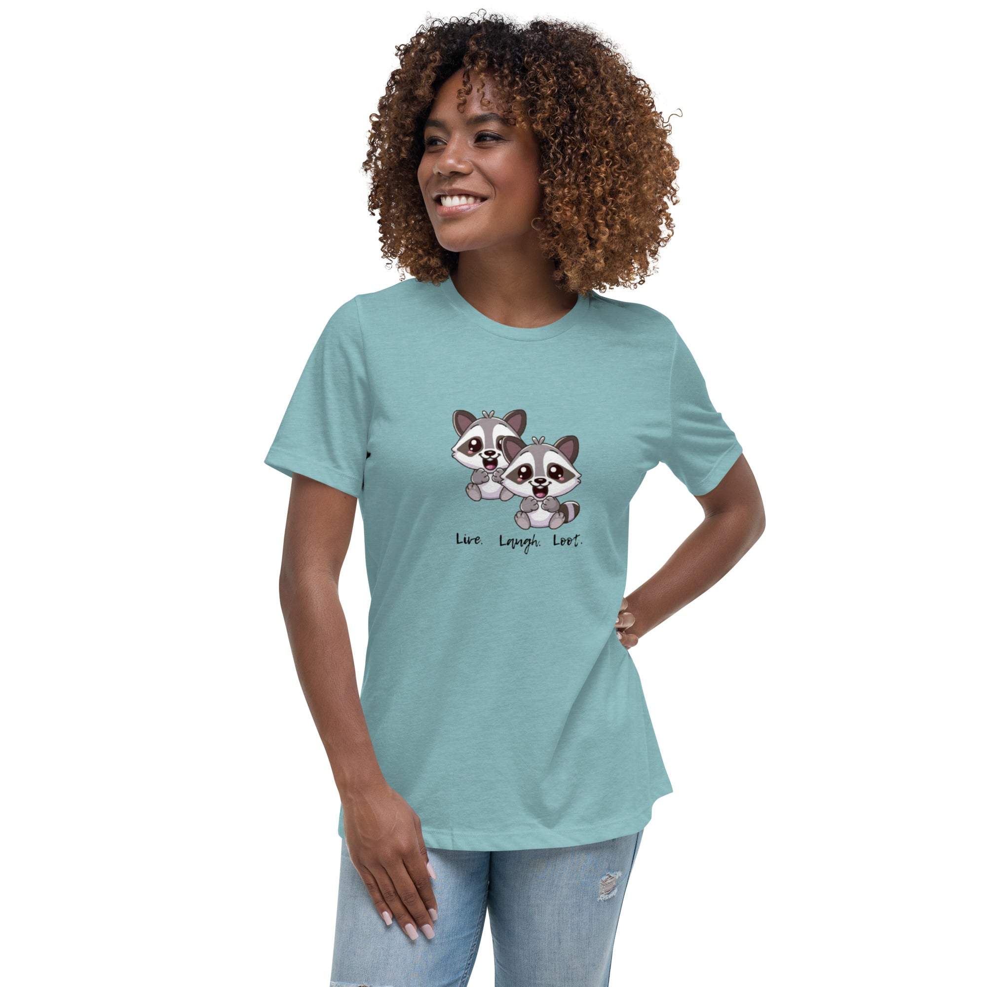Woman wearing a light blue Live Laugh Loot T-Shirt with cute raccoon graphic design and text, paired with denim jeans.