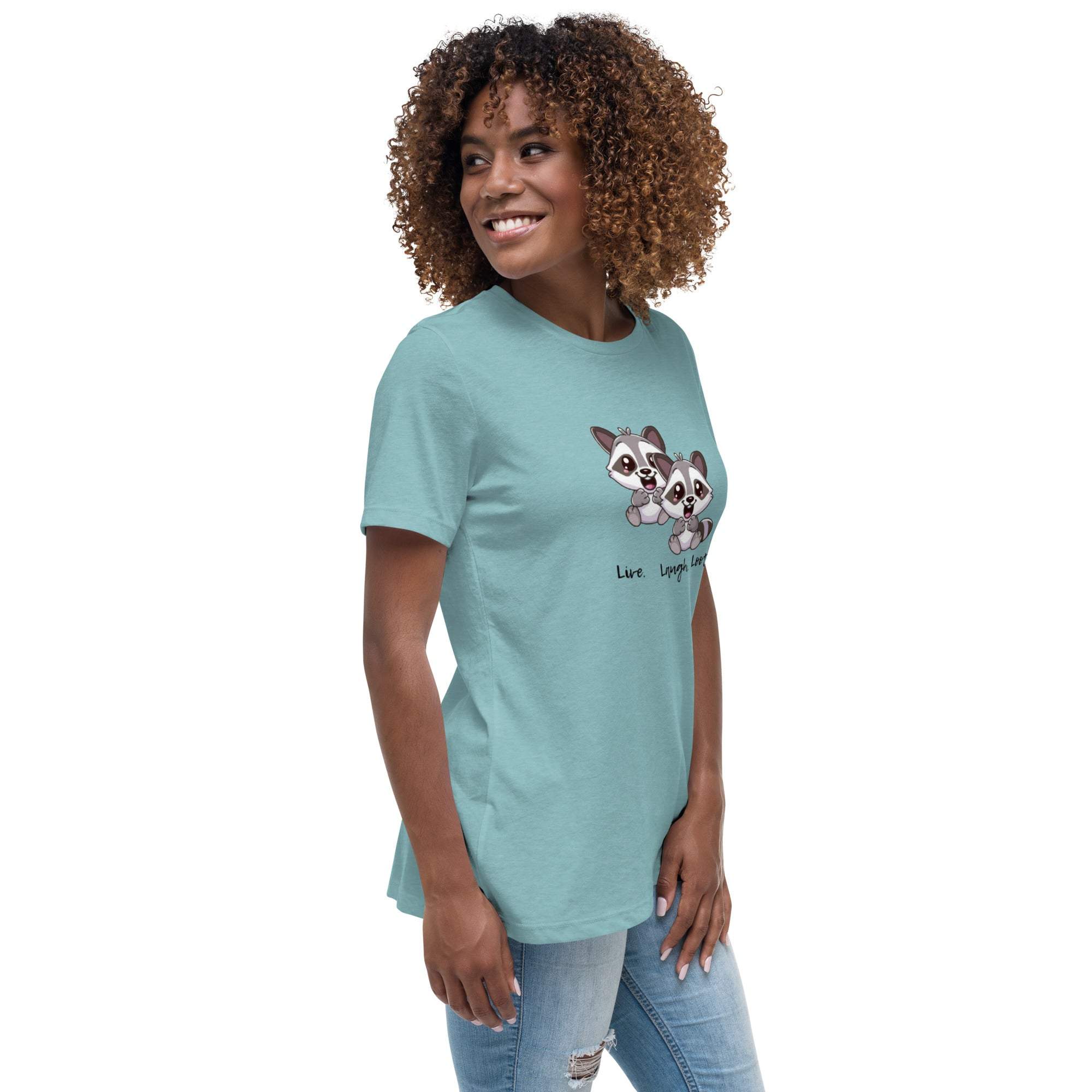 Woman wearing a light blue Live Laugh Loot T-Shirt with cute raccoon graphic and playful text on front