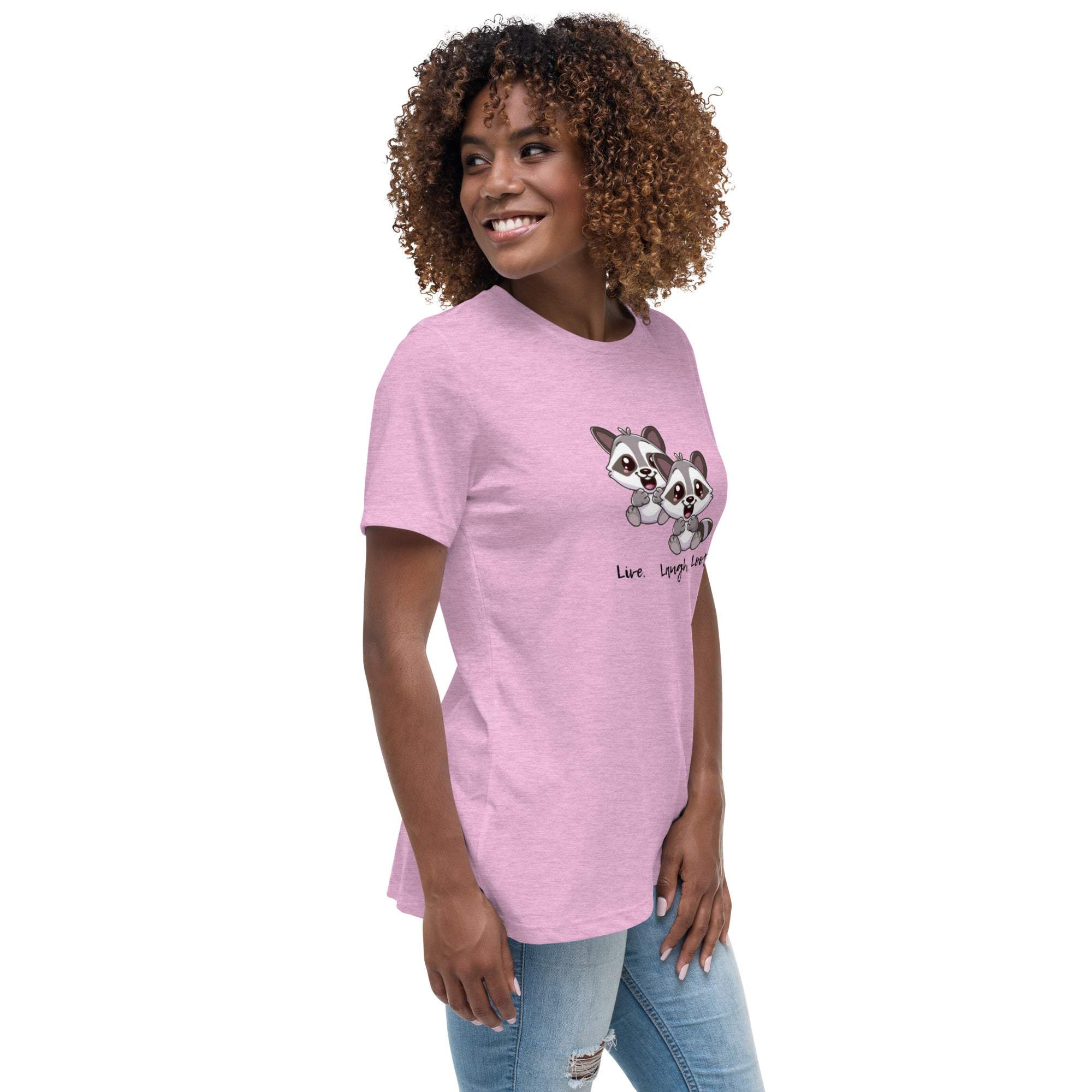 Woman wearing a pink Live Laugh Loot T-Shirt with cute raccoon graphic and text, paired with ripped jeans.