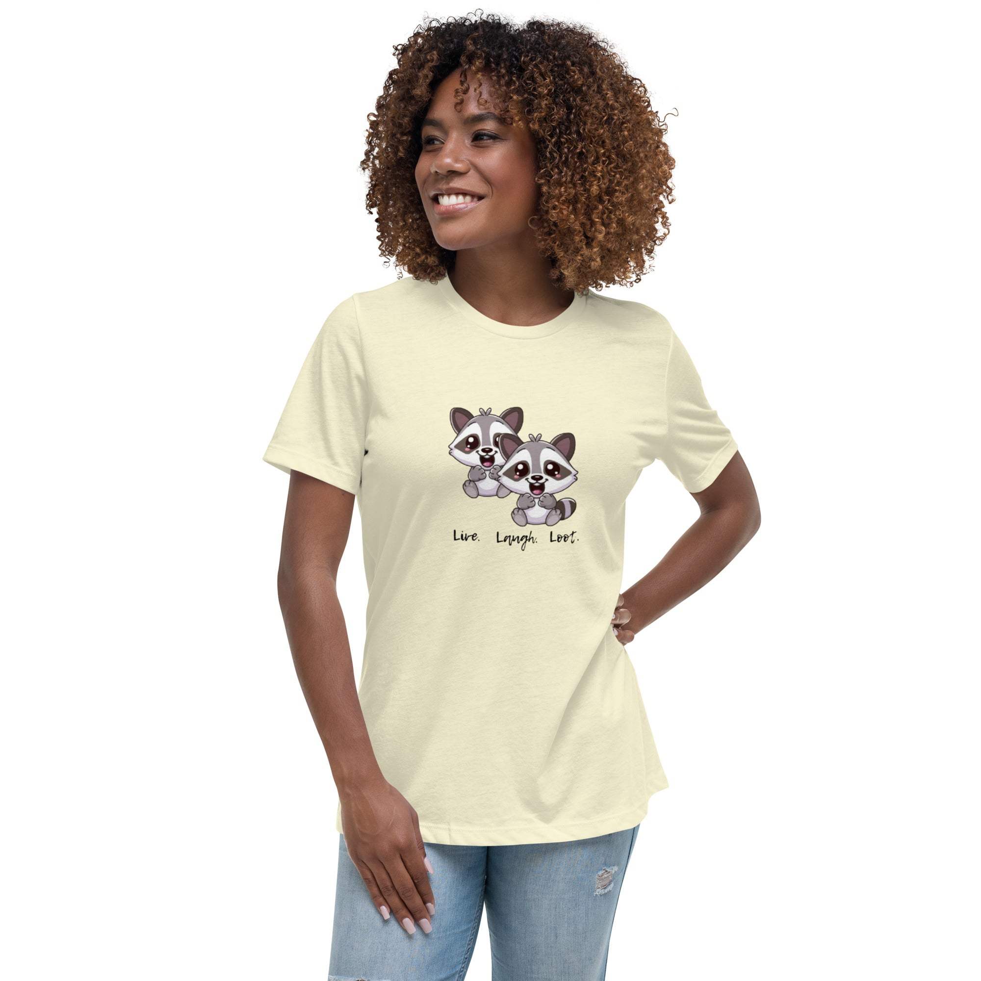 Woman wearing a light-colored Live Laugh Loot T-shirt with cute raccoon graphic and text, paired with casual jeans