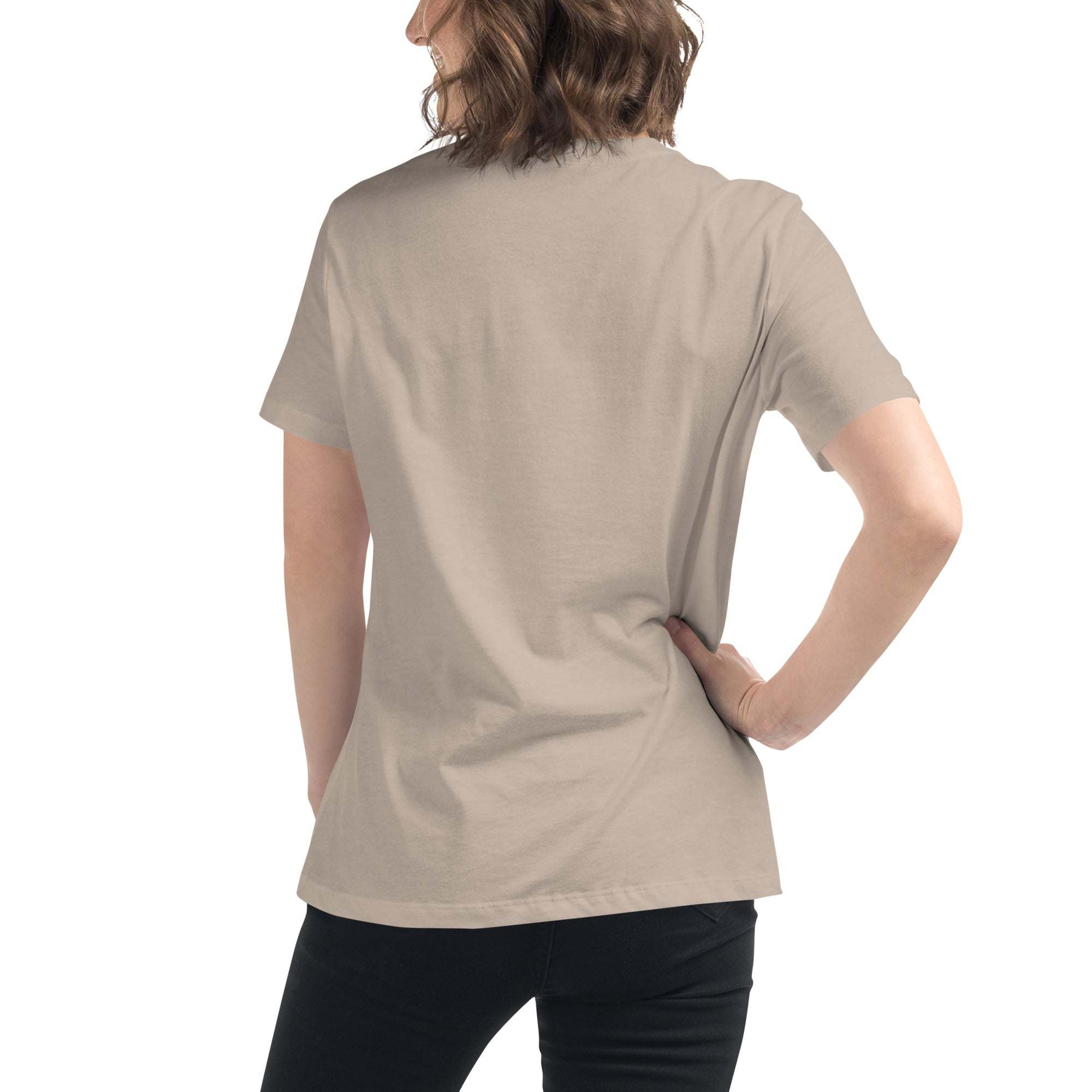 Woman wearing a beige minimalist speechless face line art t-shirt shown from the back