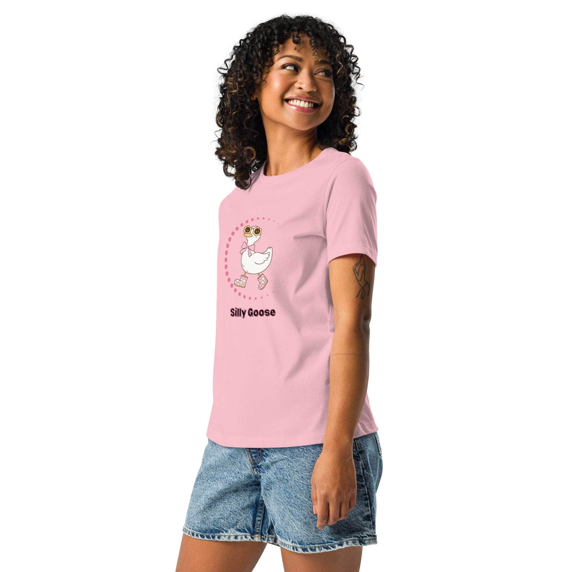 Woman wearing pink Silly Goose Graphic T-Shirt with cartoon goose illustration and text, paired with denim shorts
